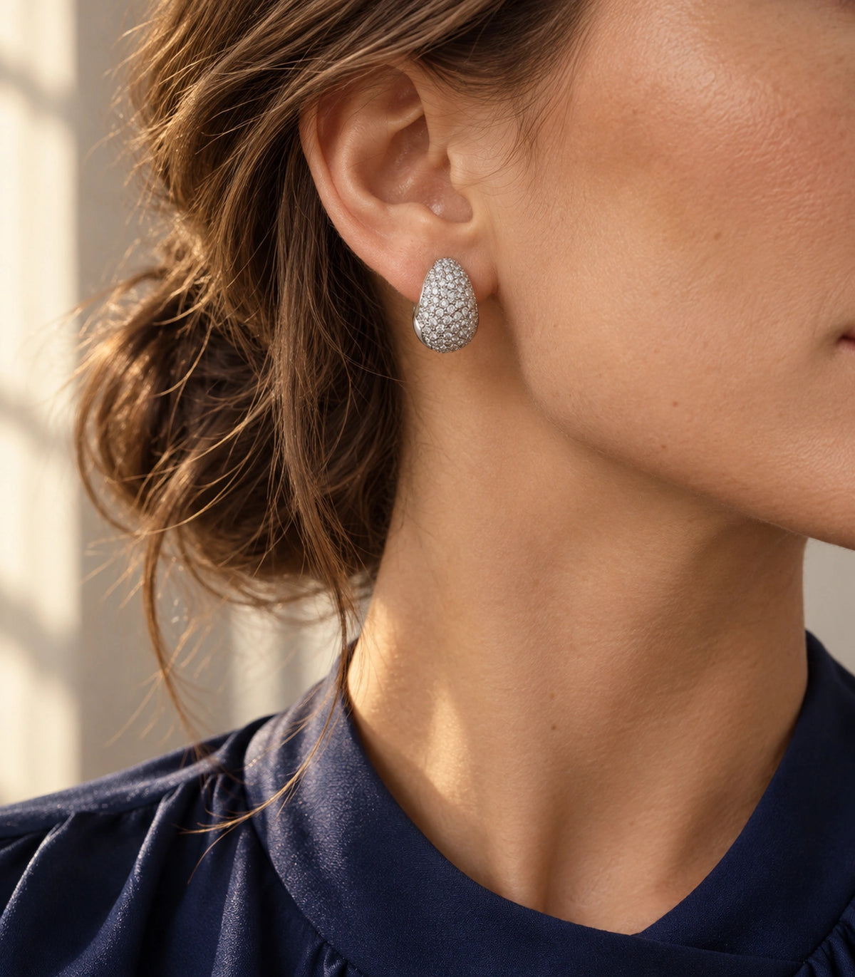 JIMIKI Silver Tone Clear Pave Domed Teardrop Stud Earring Pair in Silver tone/Clear, editorial model view