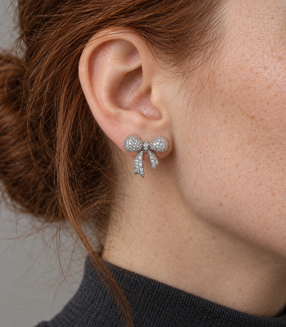 JIMIKI Pave Ribbon Bow Stud Earring Pair in Silver-tone, close-up detail #color_silver-tone