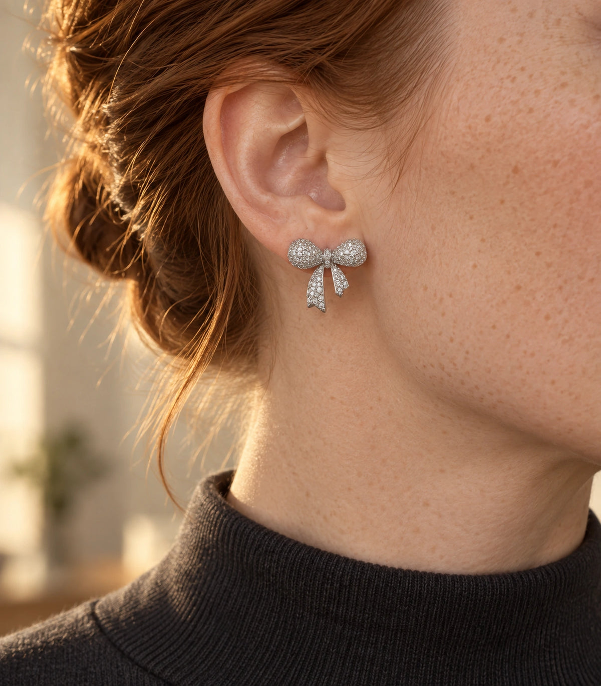 JIMIKI Pave Ribbon Bow Stud Earring Pair in Silver-tone, editorial model view #color_silver-tone