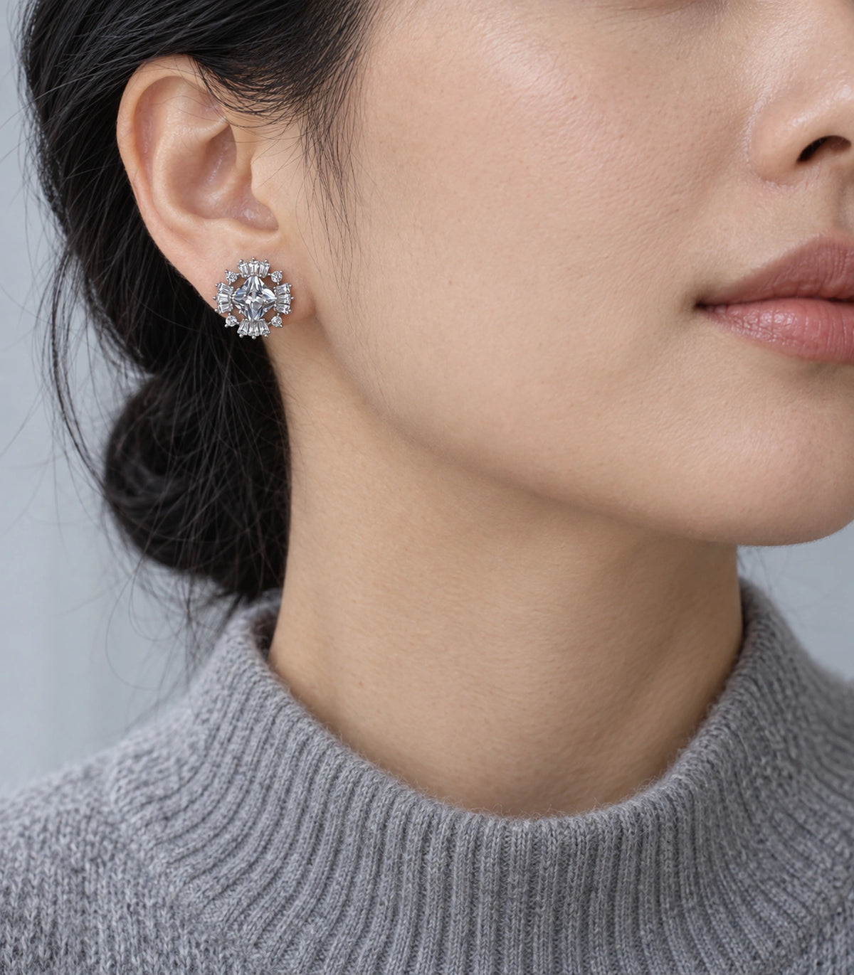 JIMIKI Star Crystal Baguette Halo Stud Earring Pair in Silver tone, model wearing view #color_silver tone