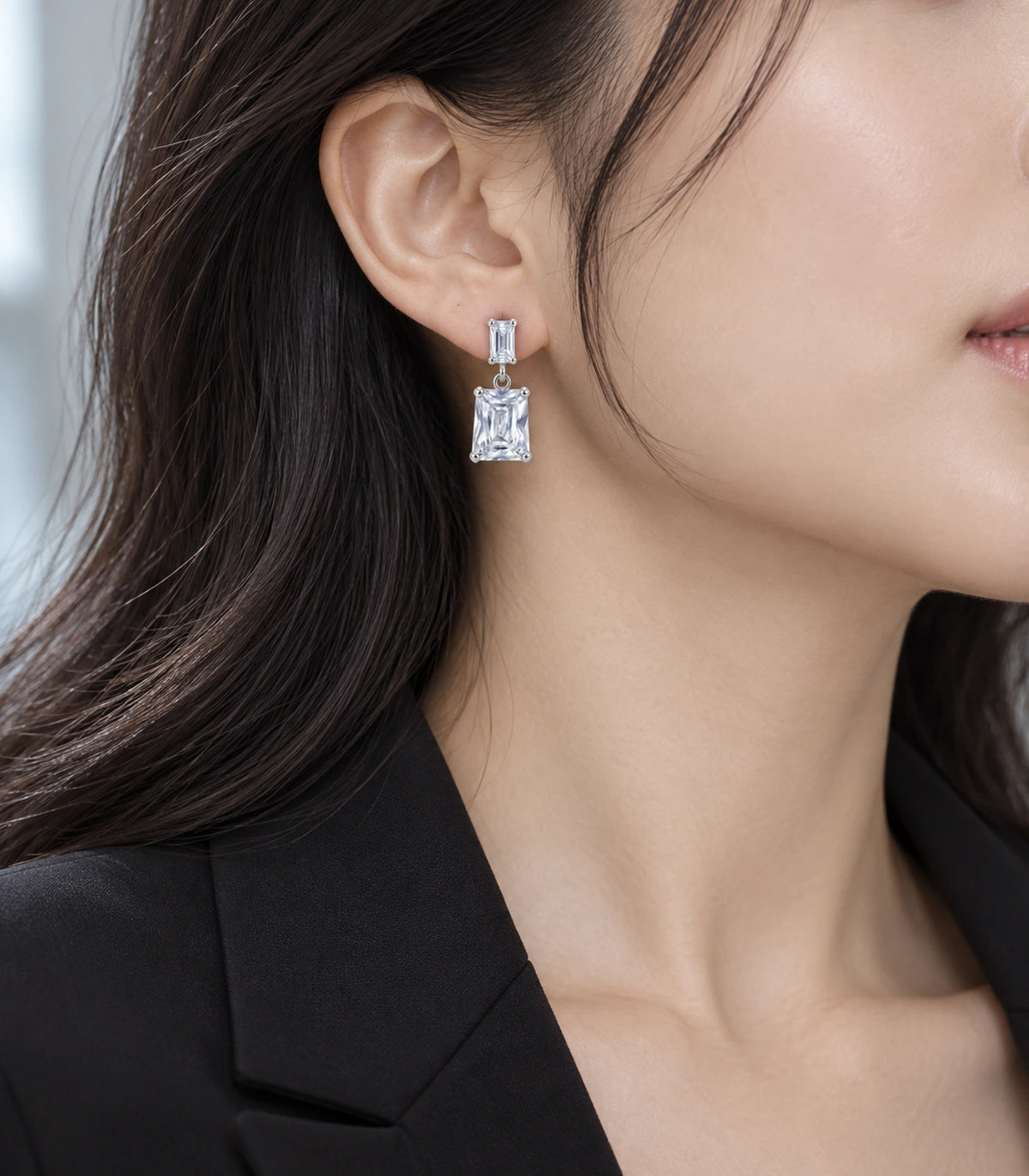 JIMIKI Silver Tone Clear Step Cut Two Stone Drop Earring Pair in Clear / Silver, editorial model view