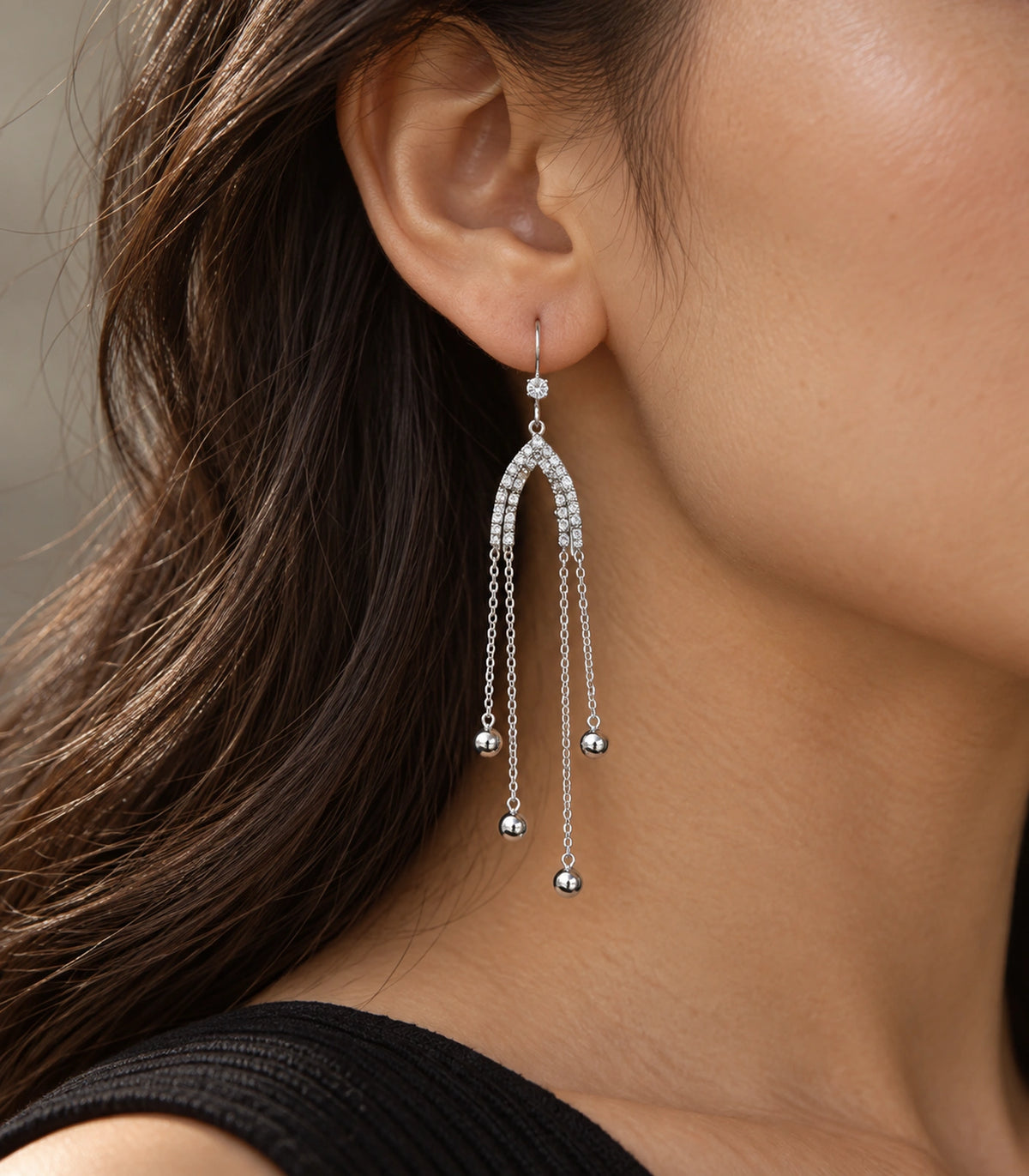 JIMIKI Silver Tone Crystal Arch Four Ball Chain Earring Pair in Silver-tone, editorial model view