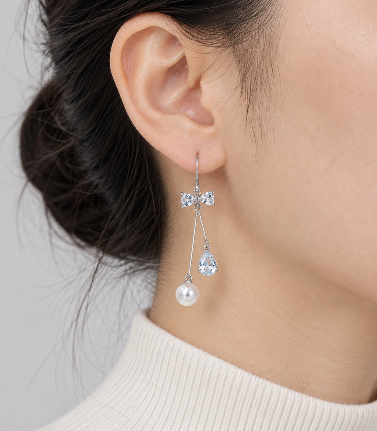 JIMIKI Silver Tone Crystal Bow Pear Pearl Wire Drop Earring Pair in Silver-tone, close-up detail