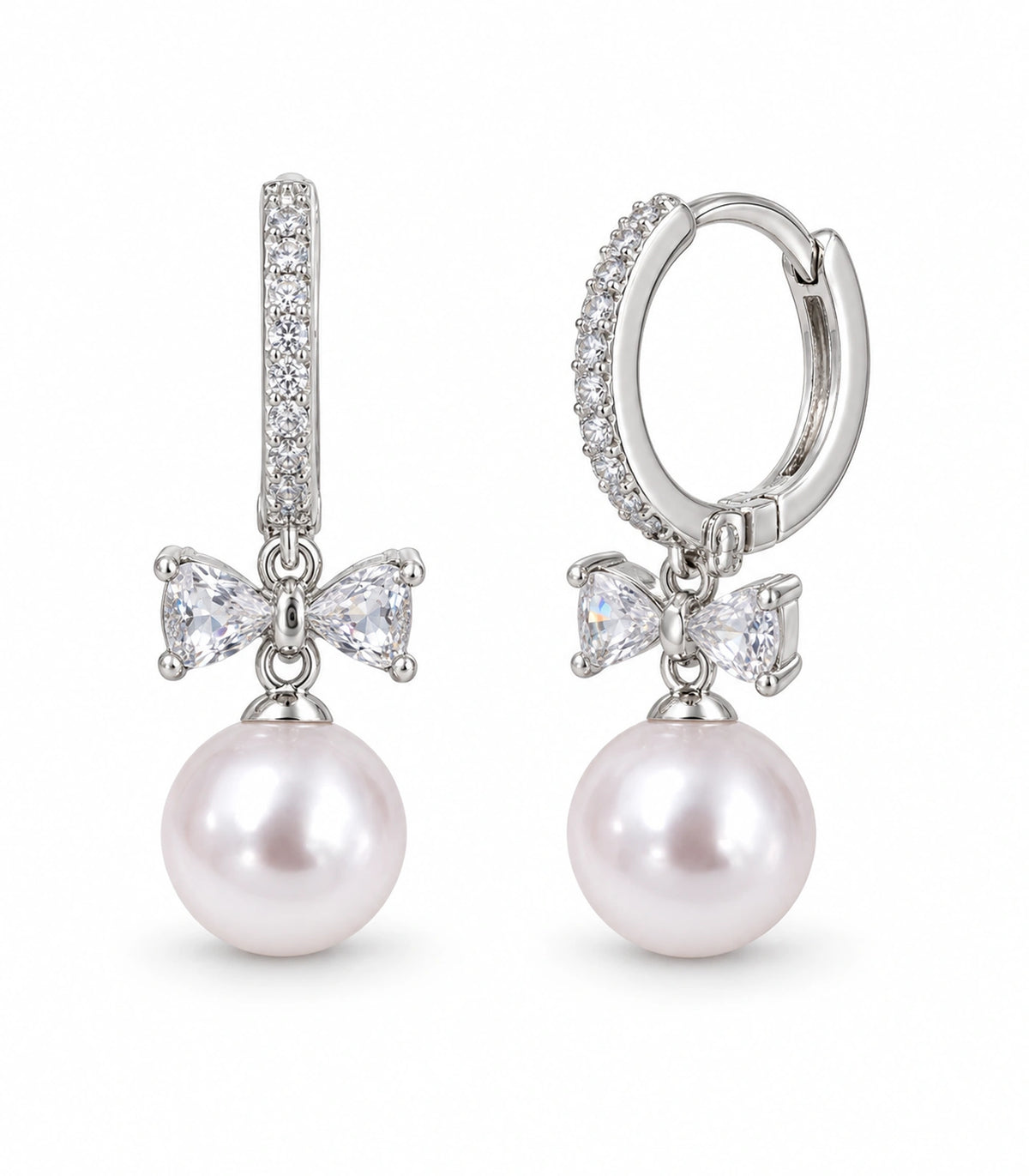 JIMIKI Silver-Tone Crystal Bow Pearl-Drop Huggie Earrings in Silver / Clear / White, white background product view
