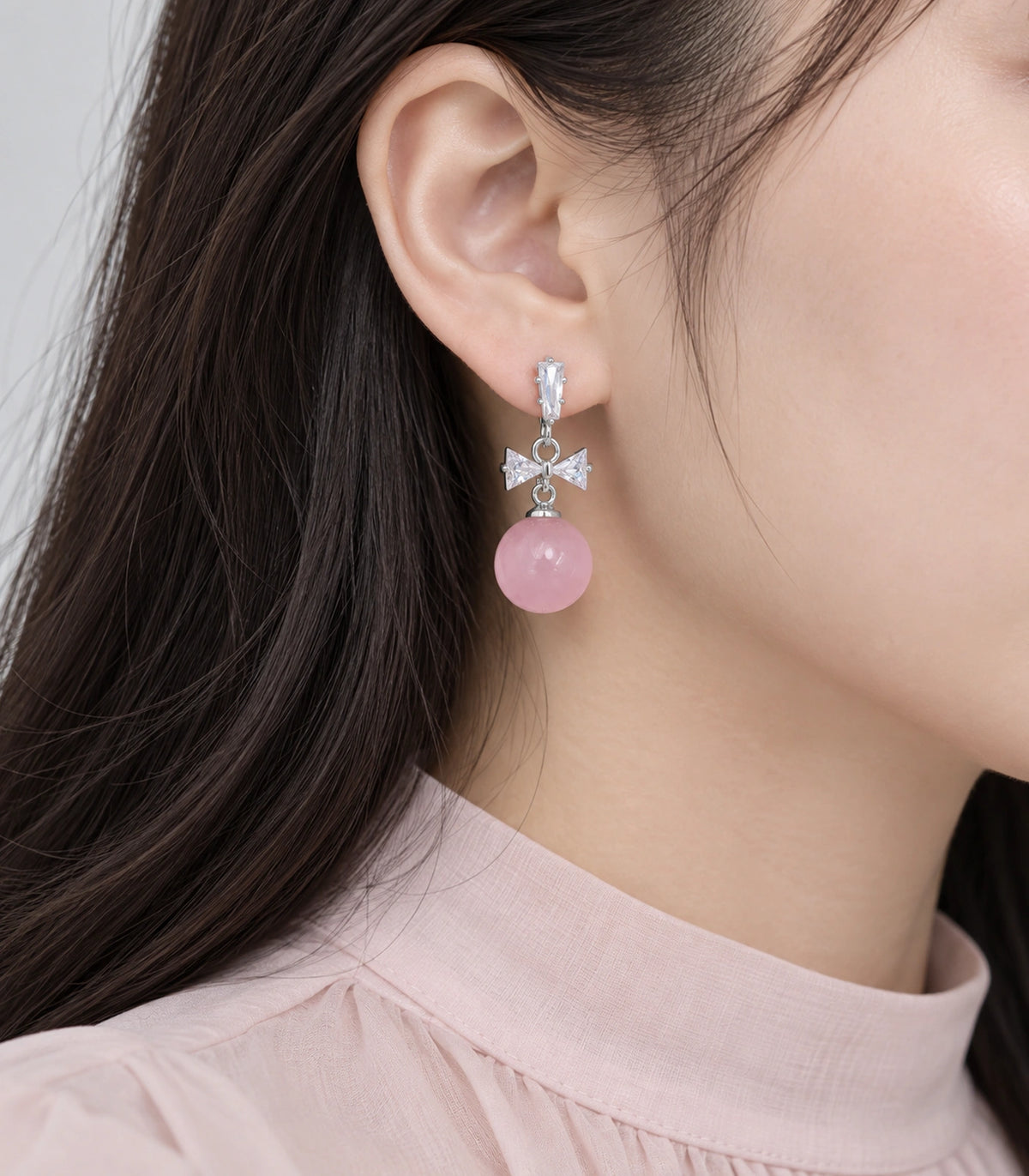 JIMIKI Silver-Tone Crystal Bow Pink Bead Drop Earrings in Silver / Clear / Pink, model wearing view