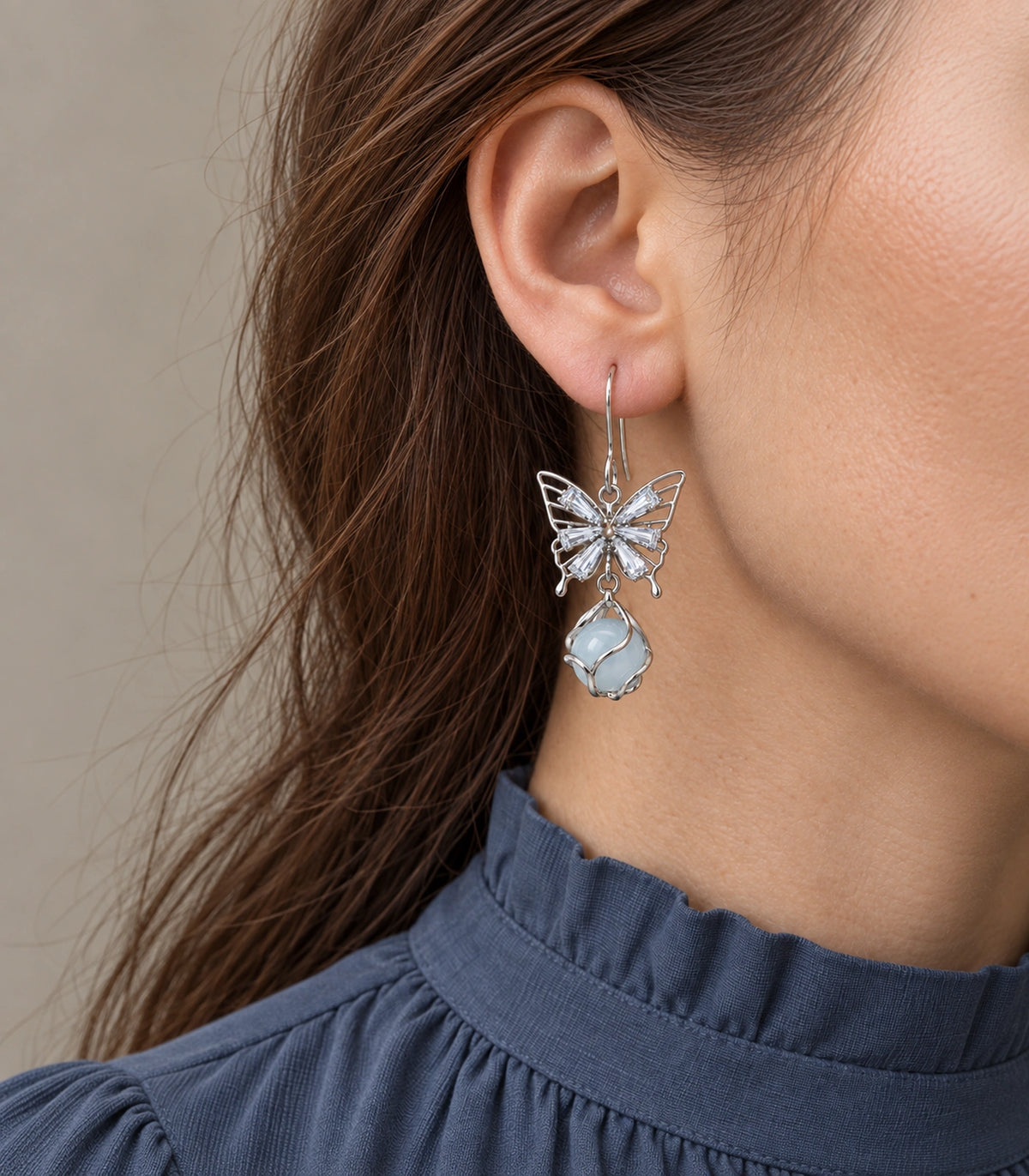 JIMIKI Silver Tone Crystal Butterfly Blue Bead Drop Earring Pair in Silver tone, close-up detail