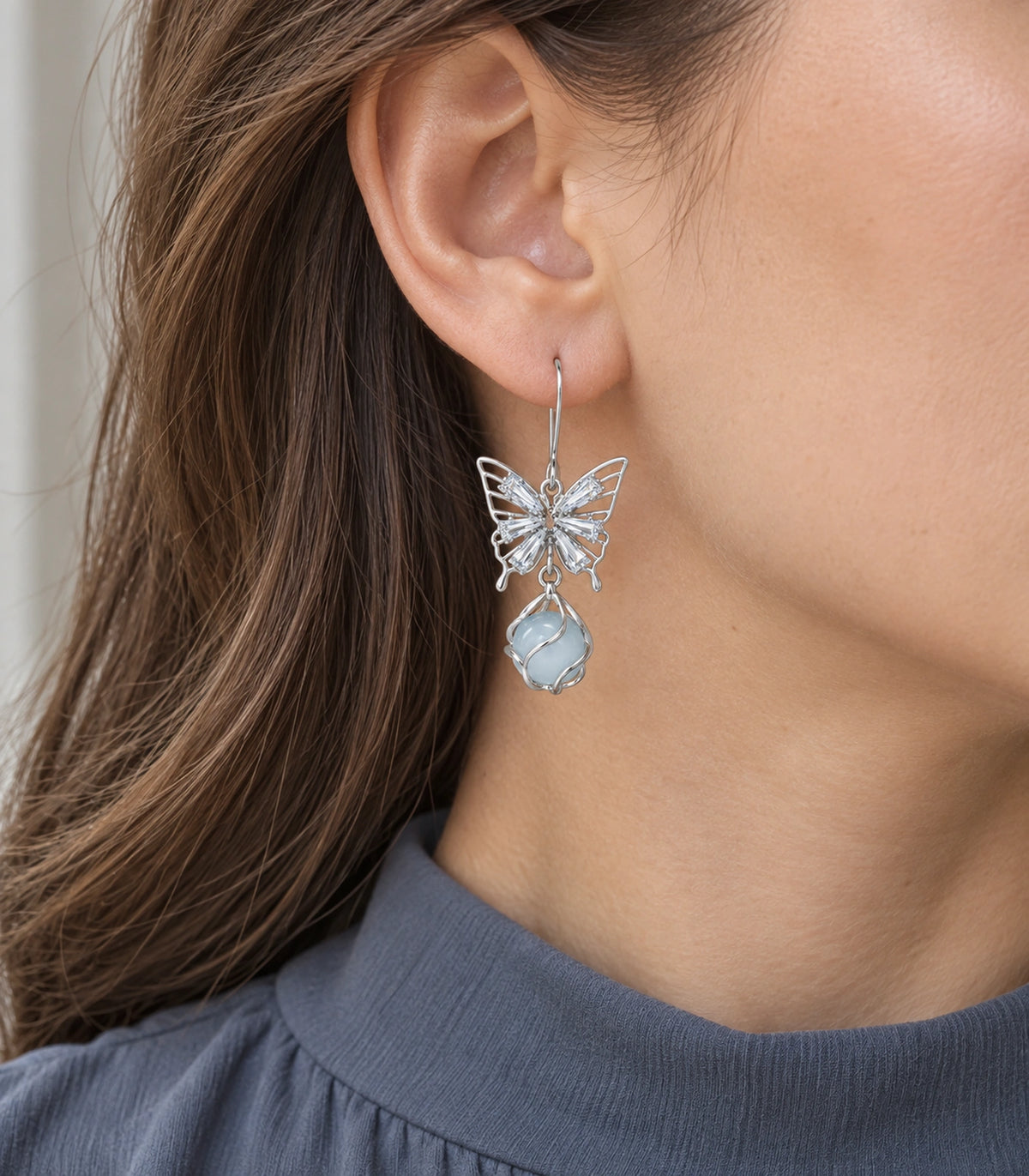 JIMIKI Silver Tone Crystal Butterfly Blue Bead Drop Earring Pair in Silver tone, model wearing view