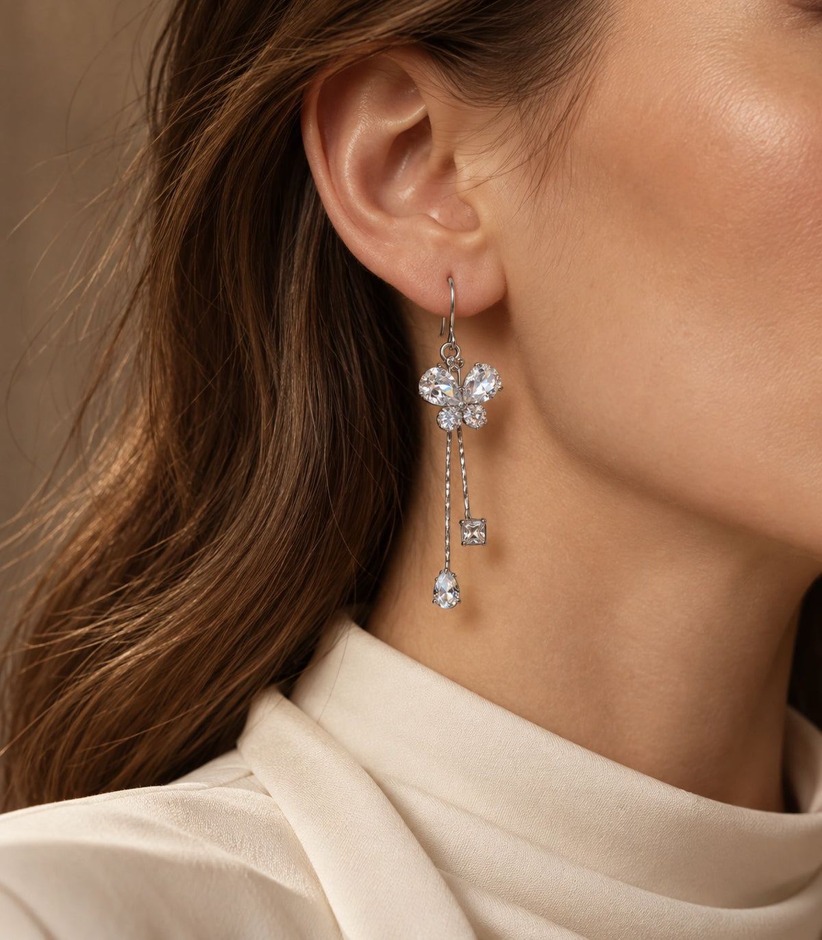 JIMIKI Silver Tone Crystal Butterfly Pear Square Chain Earring Pair in Silver-tone, editorial model view