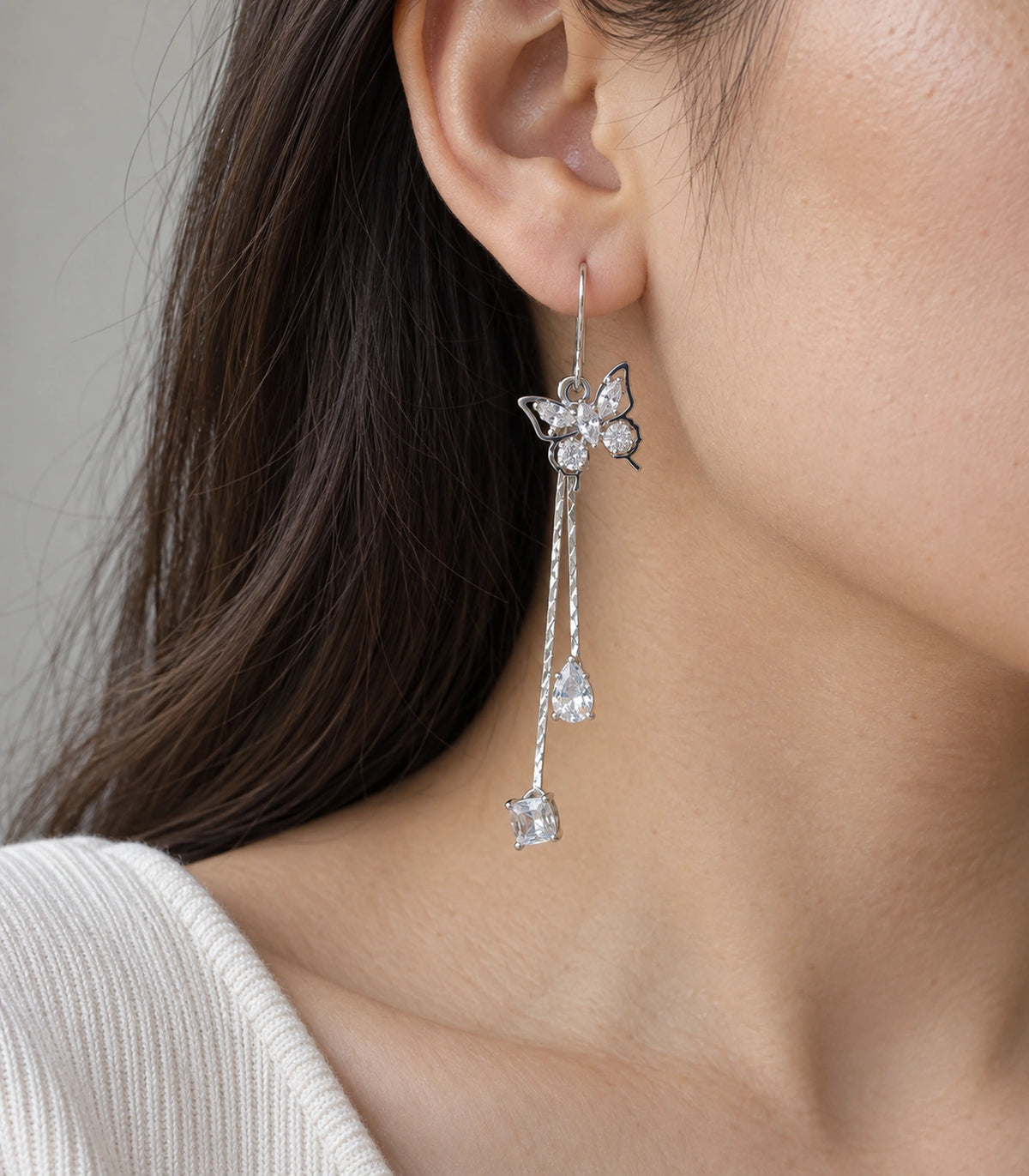 JIMIKI Silver Tone Crystal Butterfly Teardrop Tassel Earring Pair in Silver tone, close-up detail