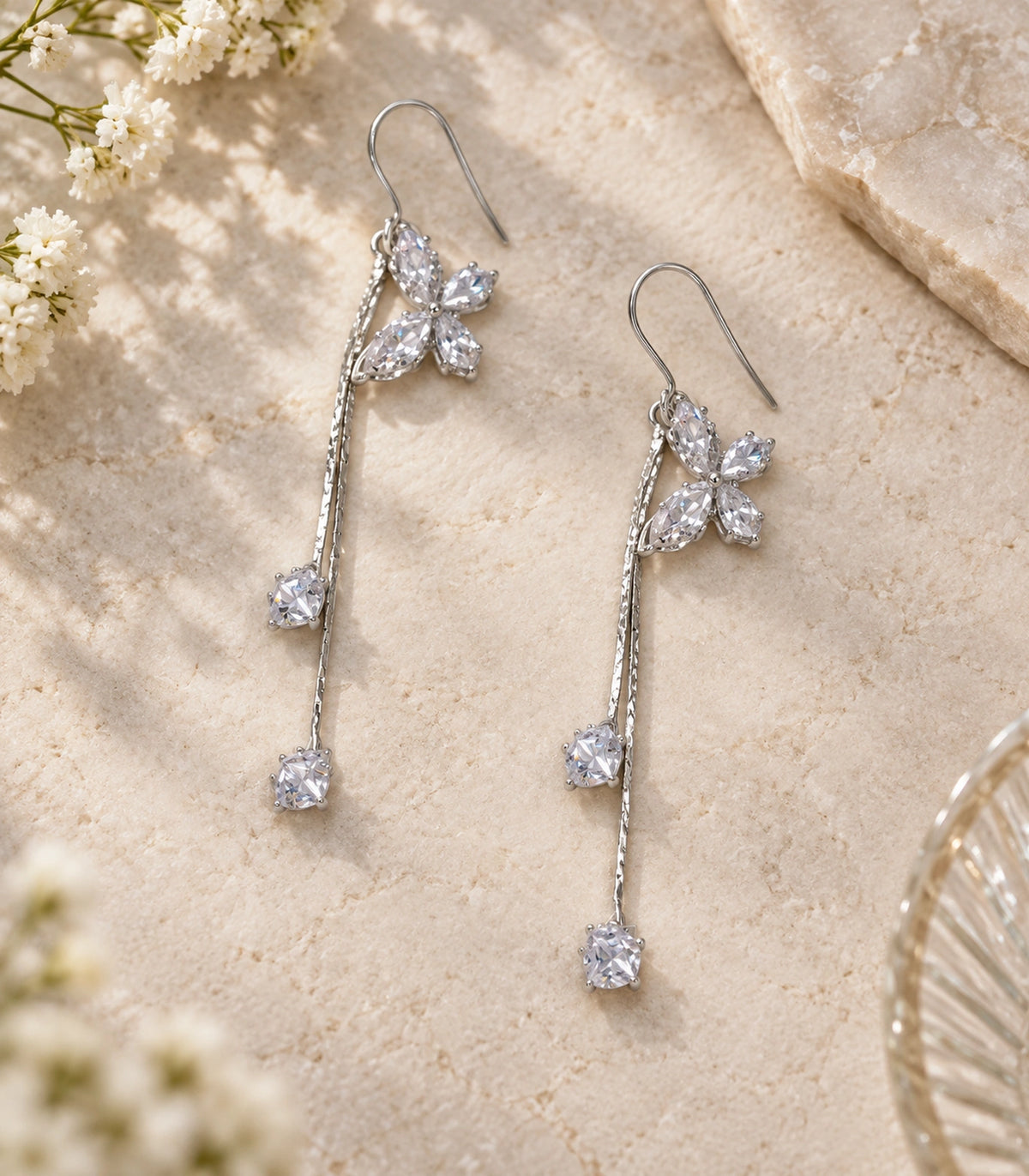 JIMIKI Silver Tone Crystal Butterfly Twin Square Chain Earring Pair in Silver-tone, editorial flat lay