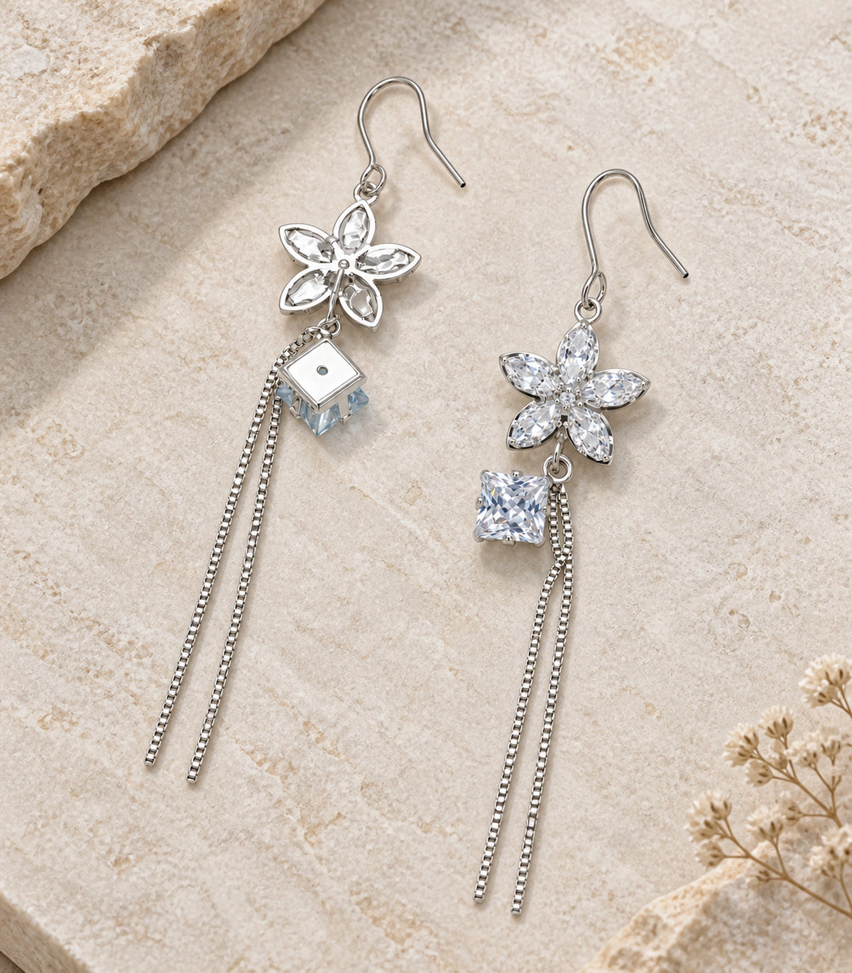 JIMIKI Silver Tone Crystal Flower Square Chain Tassel Earring Pair in Silver tone, editorial flat lay