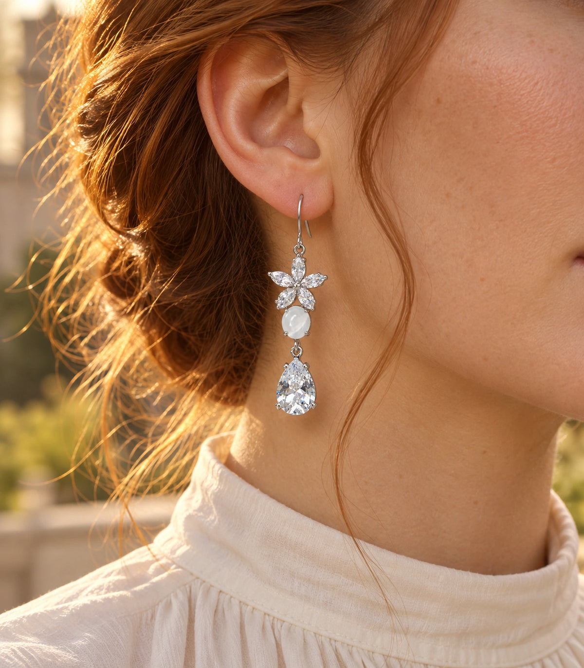 JIMIKI Silver Tone Crystal Flower White Bead Pear Drop Earring Pair in Silver tone, editorial model view