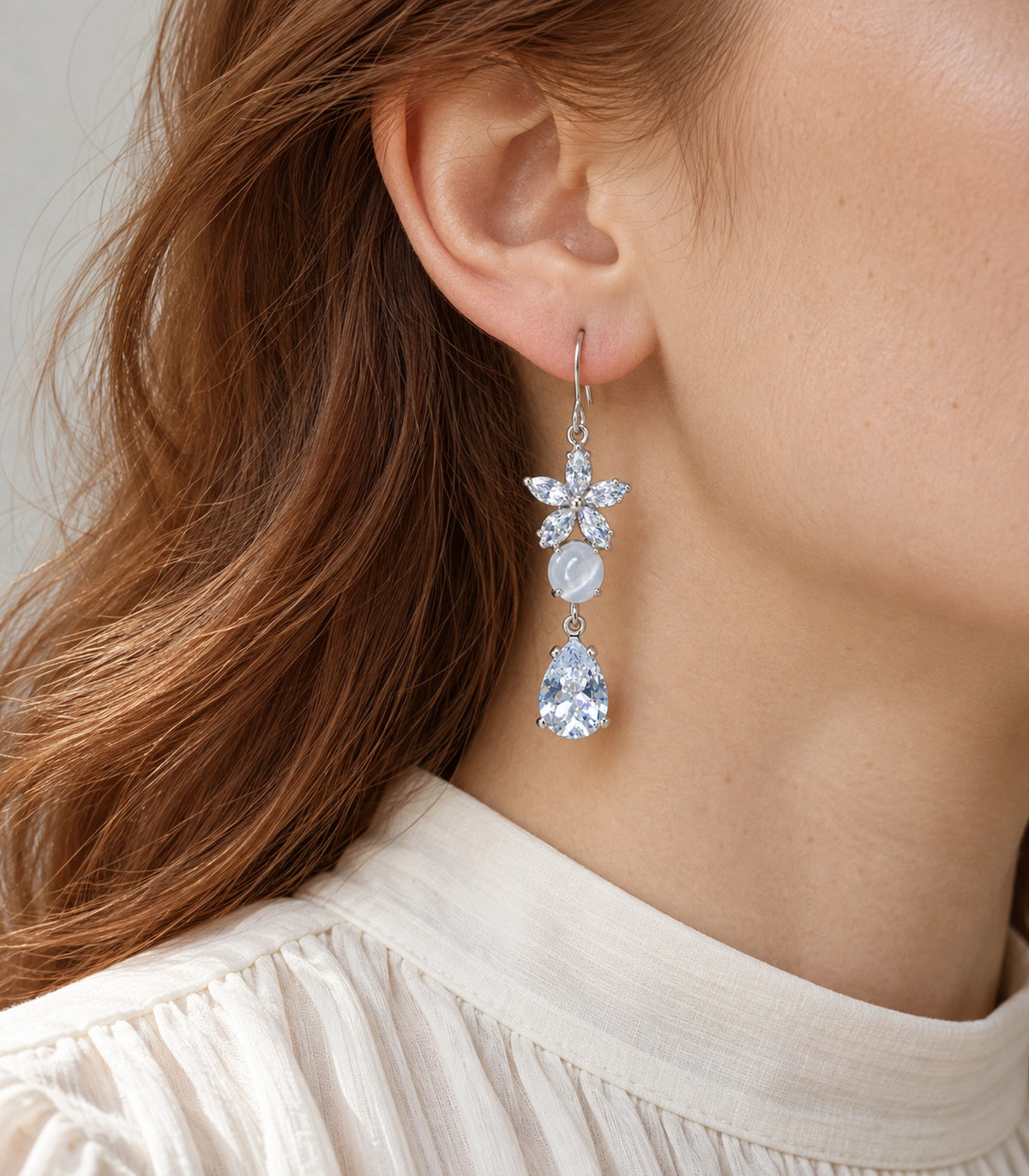 JIMIKI Silver Tone Crystal Flower White Bead Pear Drop Earring Pair in Silver tone, model wearing view
