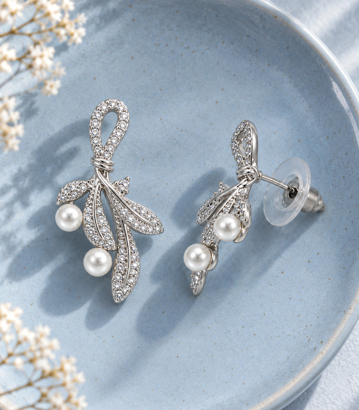 JIMIKI Crystal Leaf Two Pearl Drop Earring Pair in Silver-tone, editorial flat lay #color_silver-tone