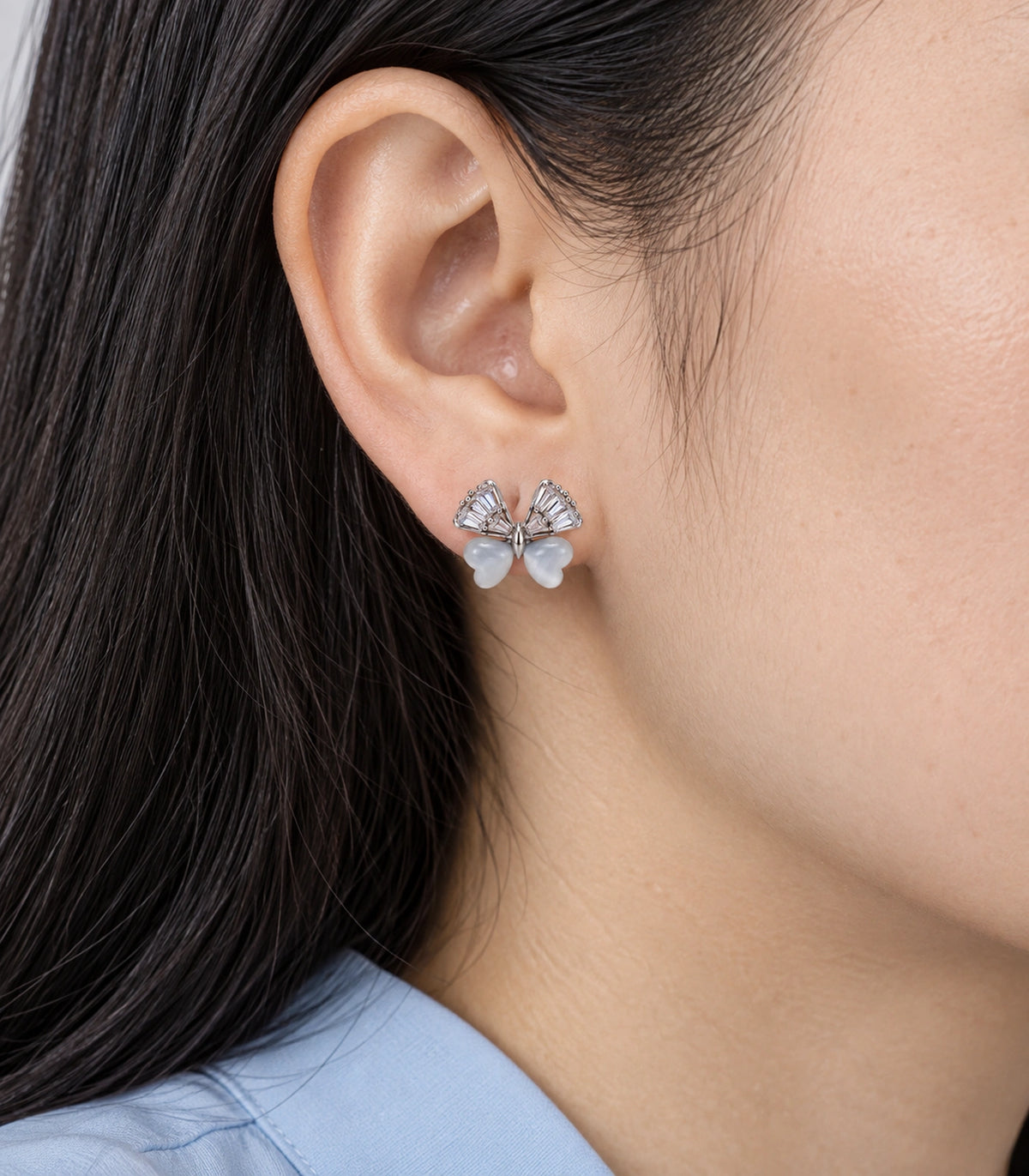 JIMIKI Crystal Wing Butterfly Stud Earring Pair in Silver Tone, close-up detail #color_silver tone