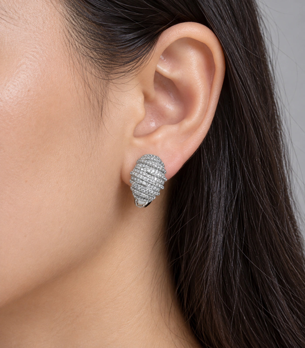 JIMIKI Crystal Ribbed Dome Huggie Earrings in Silver / Clear, close-up detail #color_silver / clear