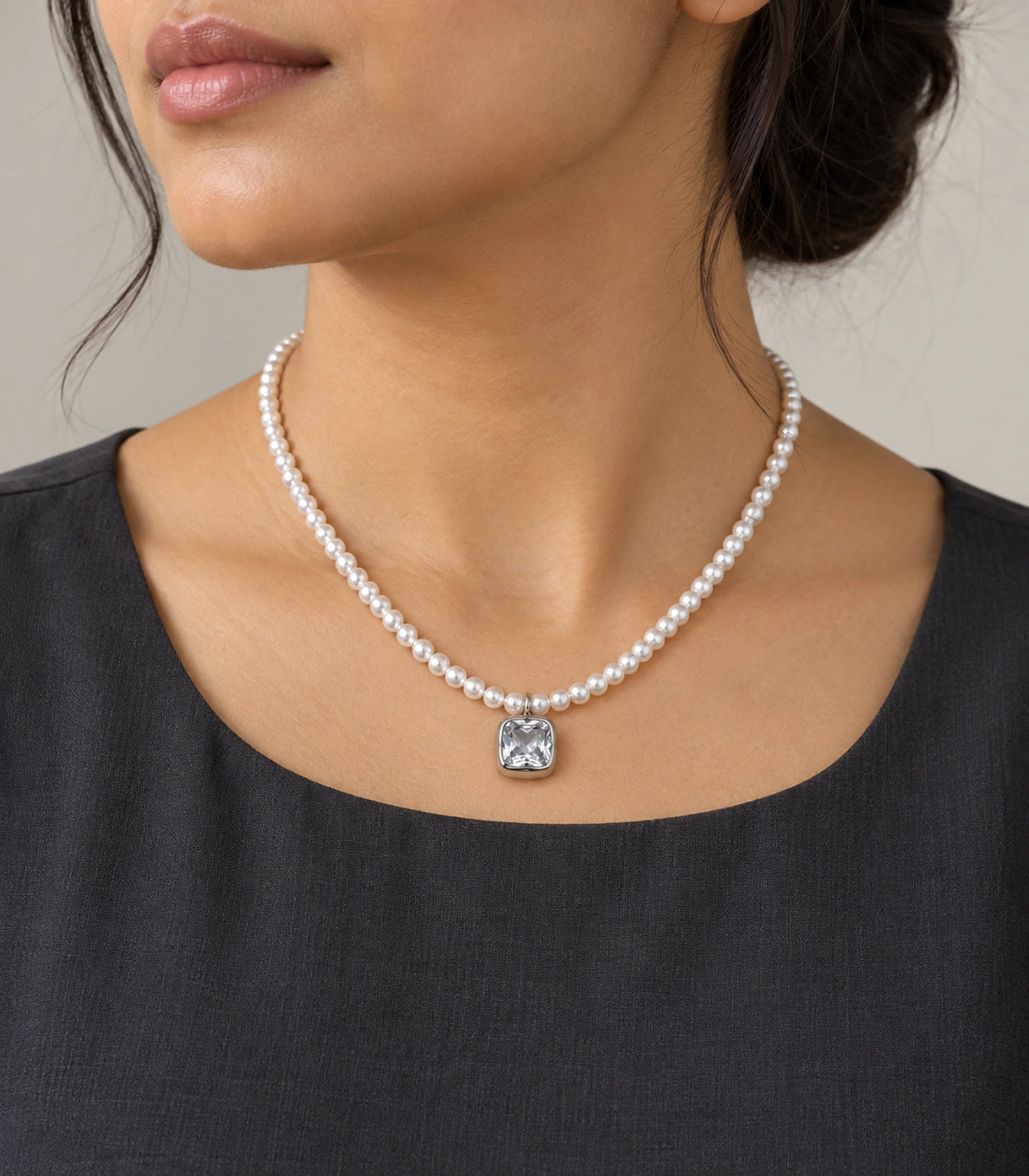 JIMIKI Silver Tone Cushion Crystal Pearl Style Necklace in Silver tone / white, editorial model view