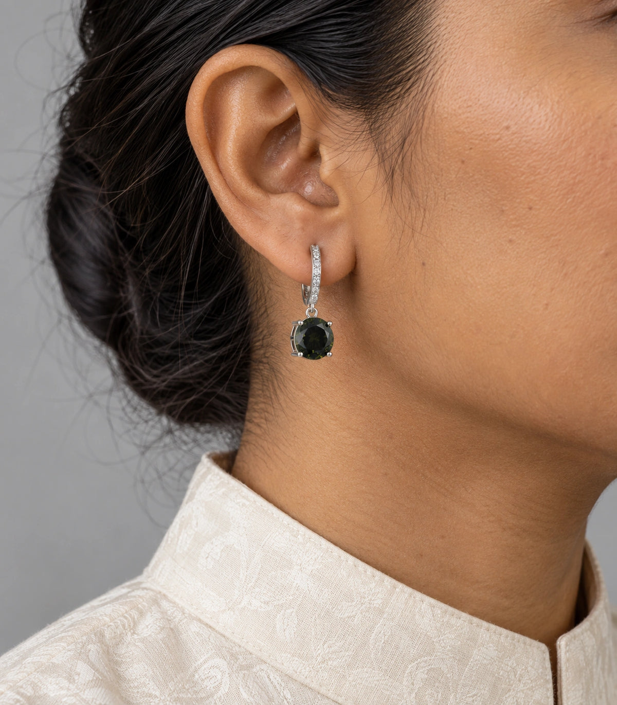 JIMIKI Round Crystal Hoop Drop Earring Pair in Silver tone / dark green, model wearing view #color_silver tone / dark green