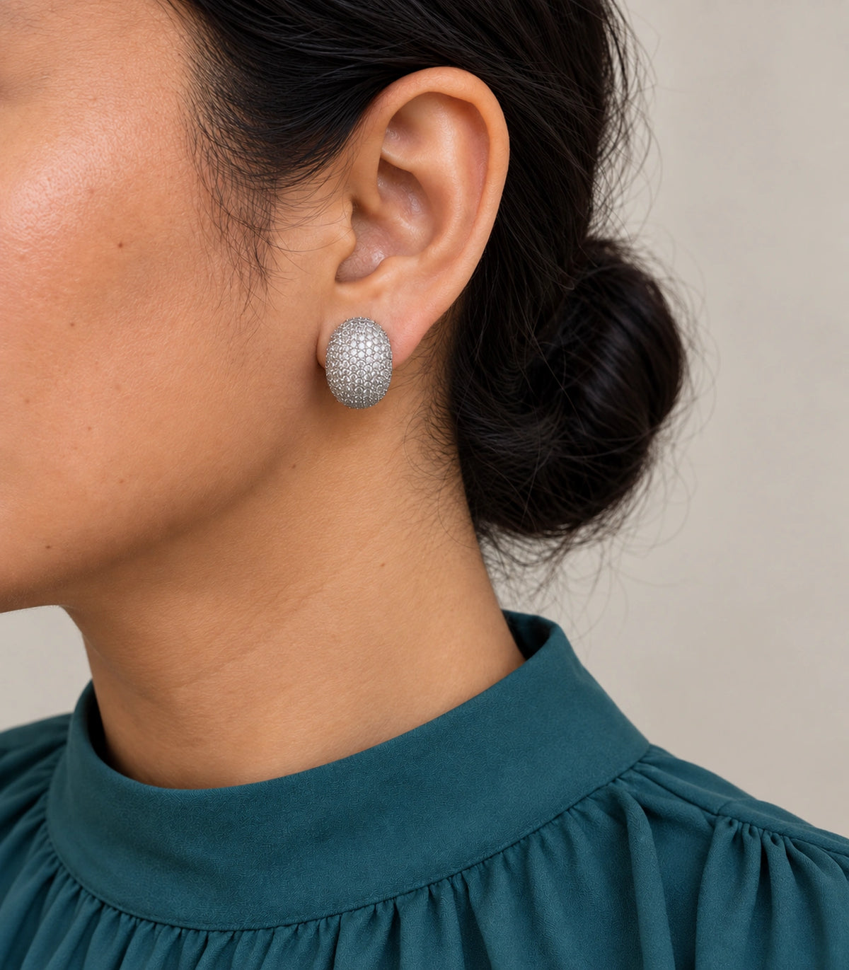 JIMIKI Domed Pave Oval Stud Earring Pair in Silver Tone, model wearing view #color_silver tone