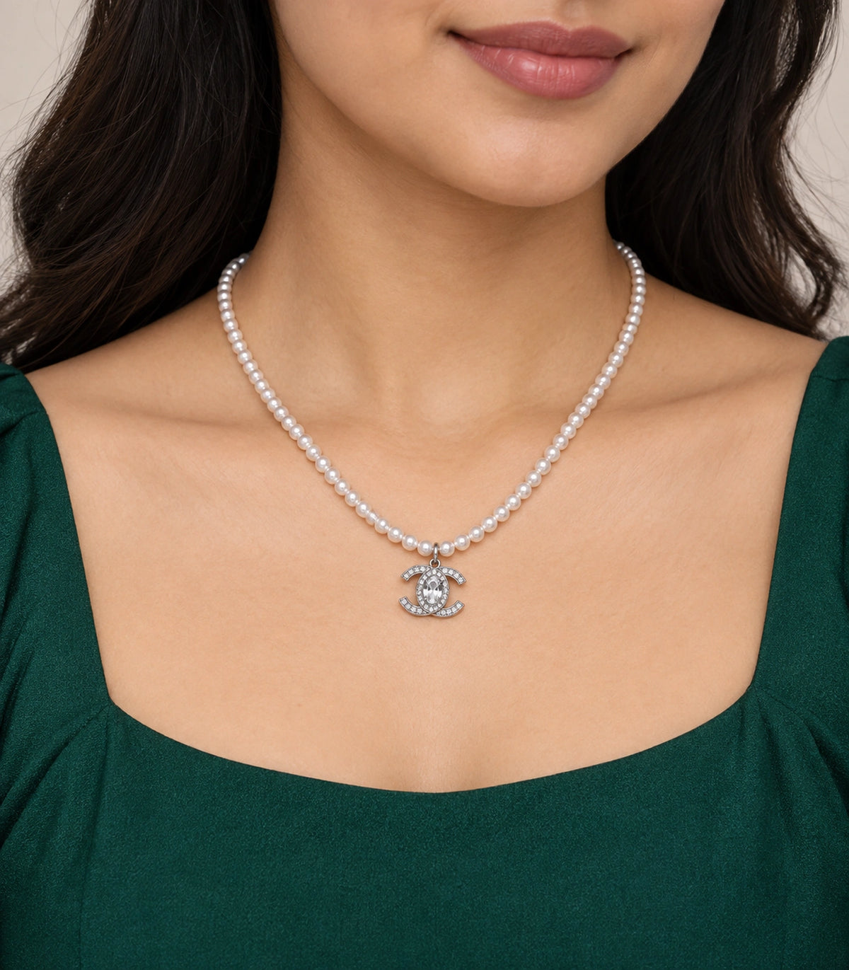 JIMIKI Silver-Tone Double-C Crystal Pearl Necklace in Silver-tone / clear / white, worn with a simple outfit
