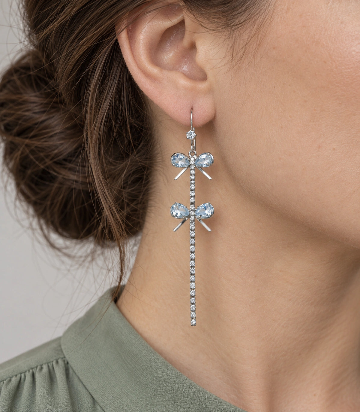 JIMIKI Silver Tone Double Crystal Bow Tassel Earring Pair in Silver-tone, close-up detail