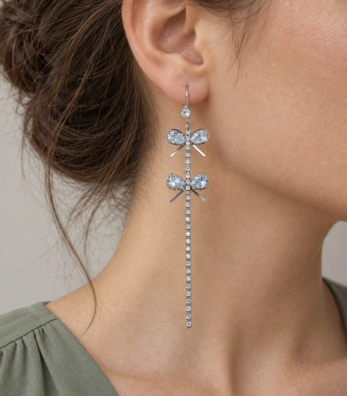 JIMIKI Silver Tone Double Crystal Bow Tassel Earring Pair in Silver-tone, model wearing view