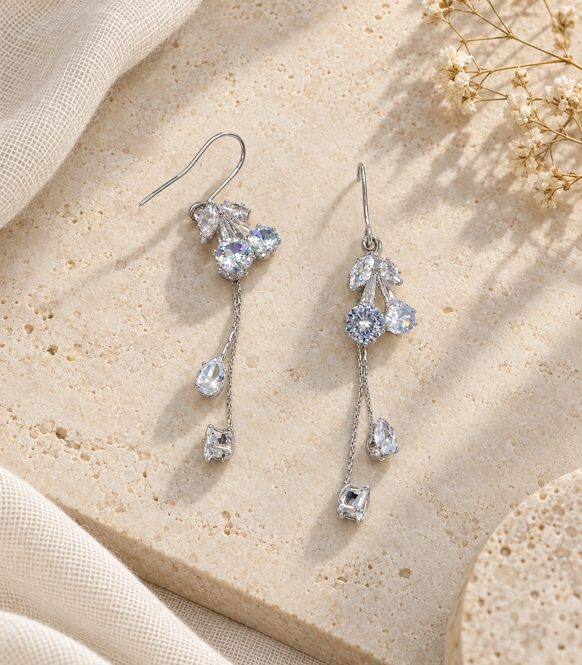 JIMIKI Silver Tone Five Leaf Crystal Twin Chain Earring Pair in Silver-tone, editorial flat lay
