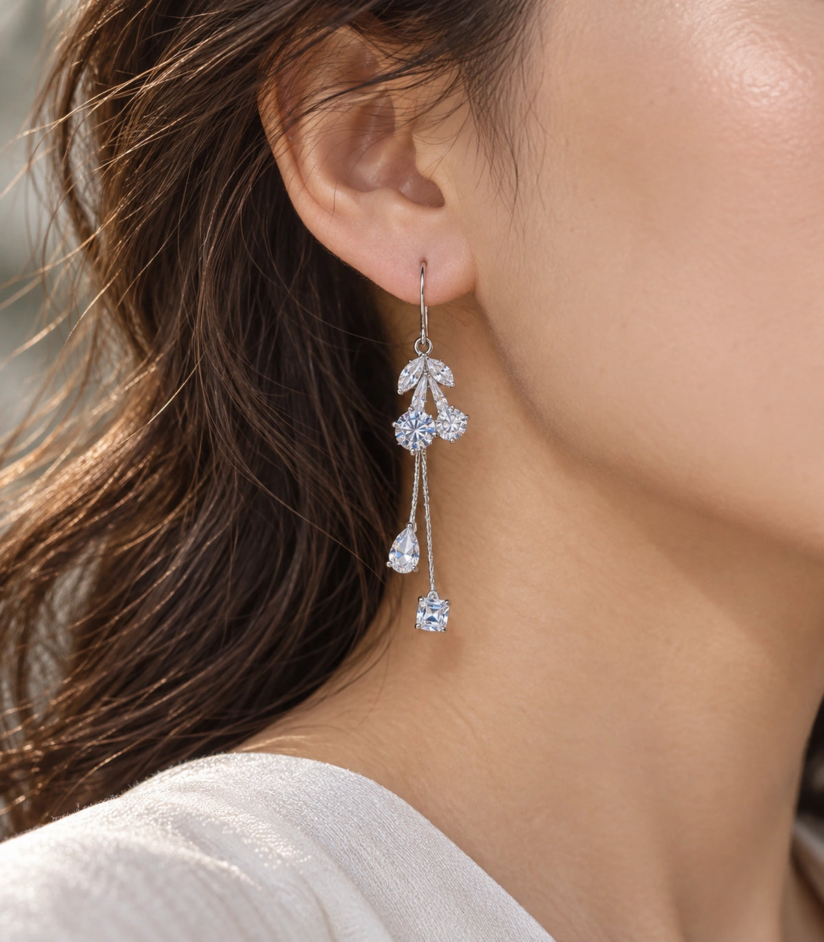 JIMIKI Silver Tone Five Leaf Crystal Twin Chain Earring Pair in Silver-tone, editorial model view