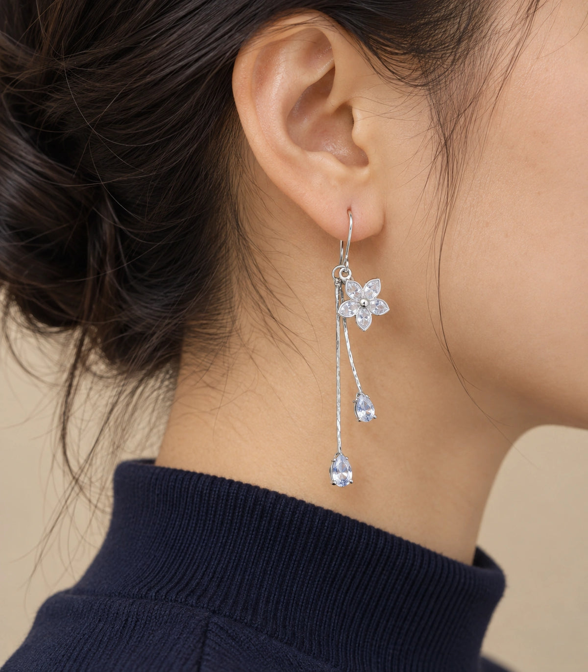JIMIKI Silver Tone Five Petal Flower Twin Pear Drop Earring Pair in Silver-tone, editorial model view