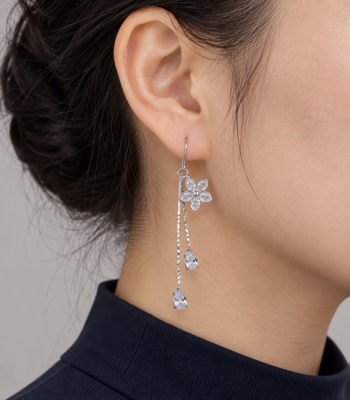 JIMIKI Silver Tone Five Petal Flower Twin Pear Drop Earring Pair in Silver-tone, model wearing view
