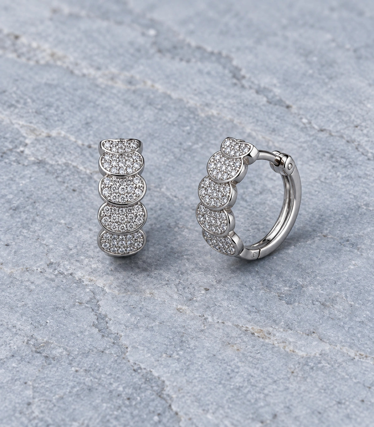 JIMIKI Five Scallop Pave Hinged Hoop Earring Pair in Silver Tone, editorial flat lay #color_silver tone