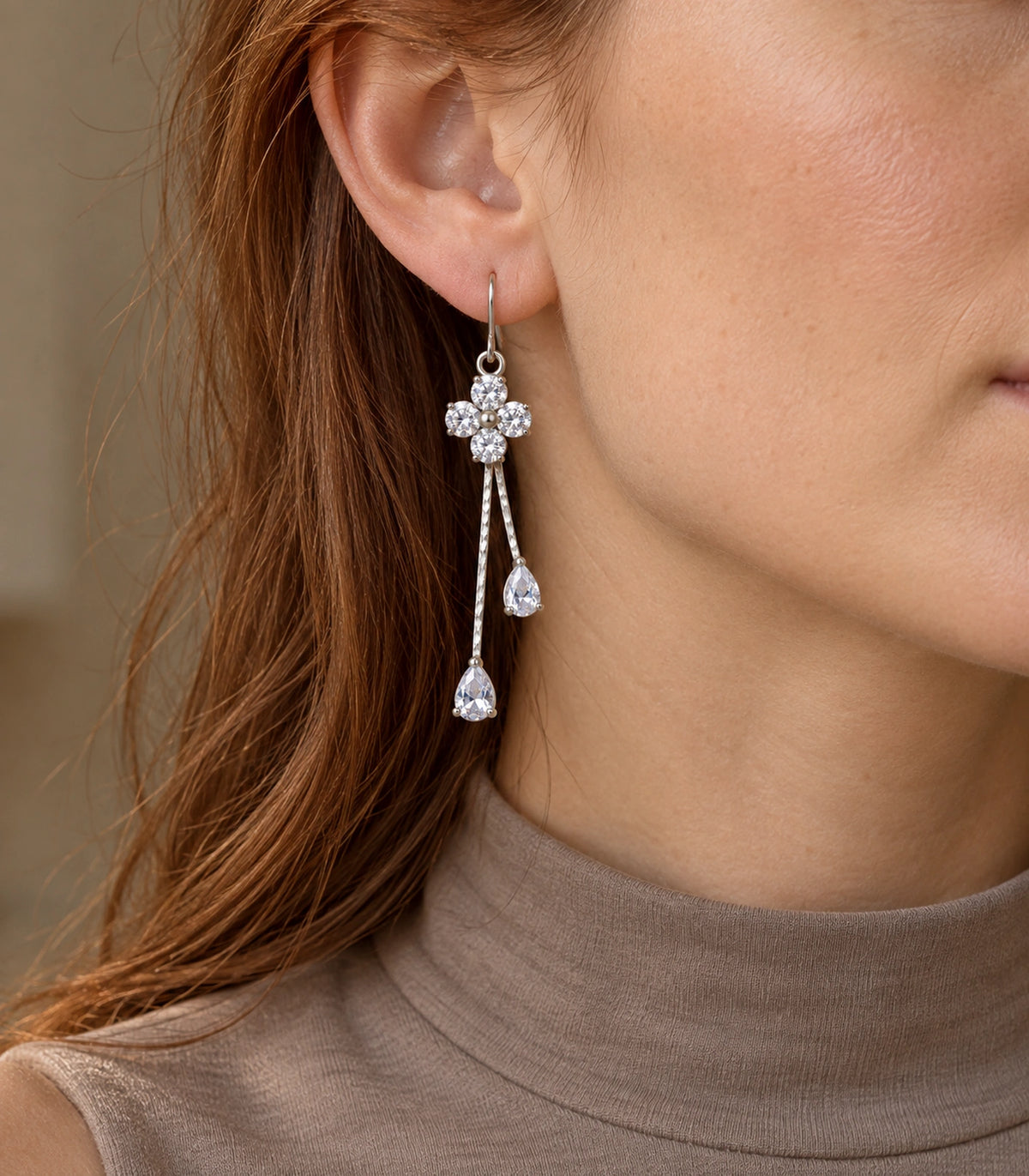 JIMIKI Silver-Tone Four Round Crystal Flower Twin Pear Drop Earrings in Silver Tone, editorial model view