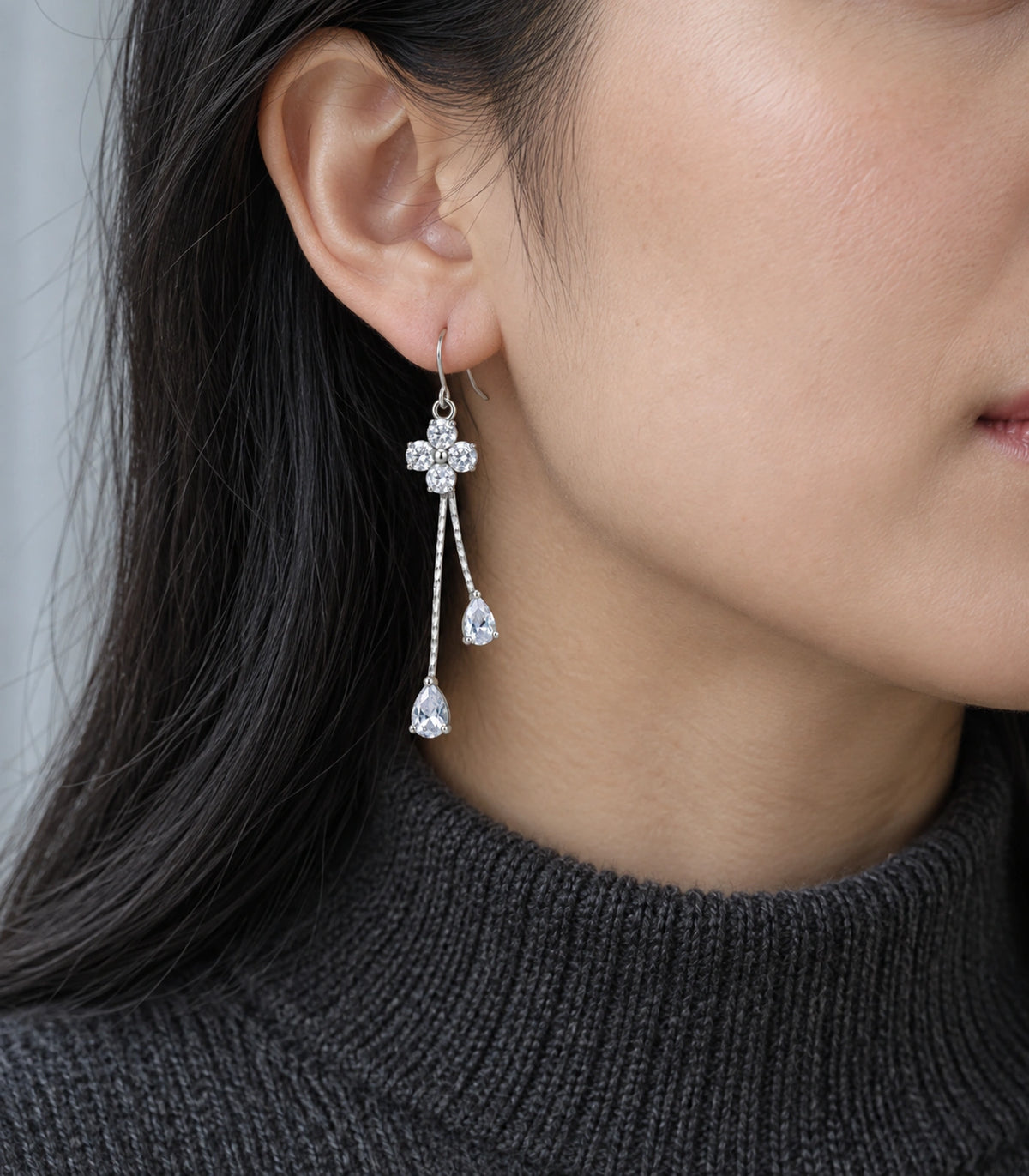 JIMIKI Silver-Tone Four Round Crystal Flower Twin Pear Drop Earrings in Silver Tone, model wearing view