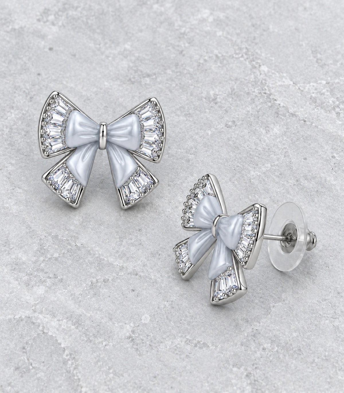 JIMIKI Silver Tone Grey Bow Clear Crystal Stud Earring Pair in Silver tone, editorial flat lay