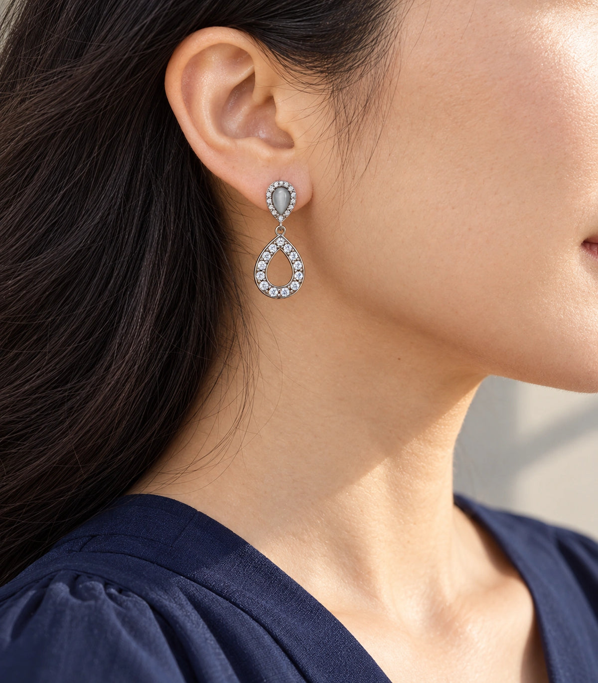 JIMIKI Silver-Tone Grey Teardrop Crystal Halo Drop Earring Pair in Silver Tone, editorial model view