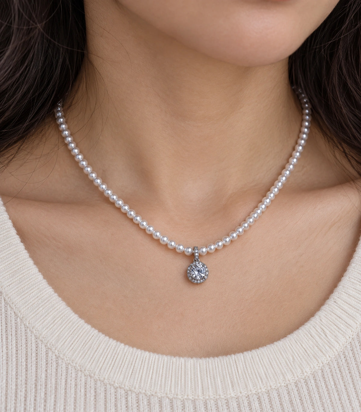 JIMIKI Silver-Tone Halo Crystal Pearl Necklace in Silver-tone / clear / white, close-up of the pendant and pearl-style strand