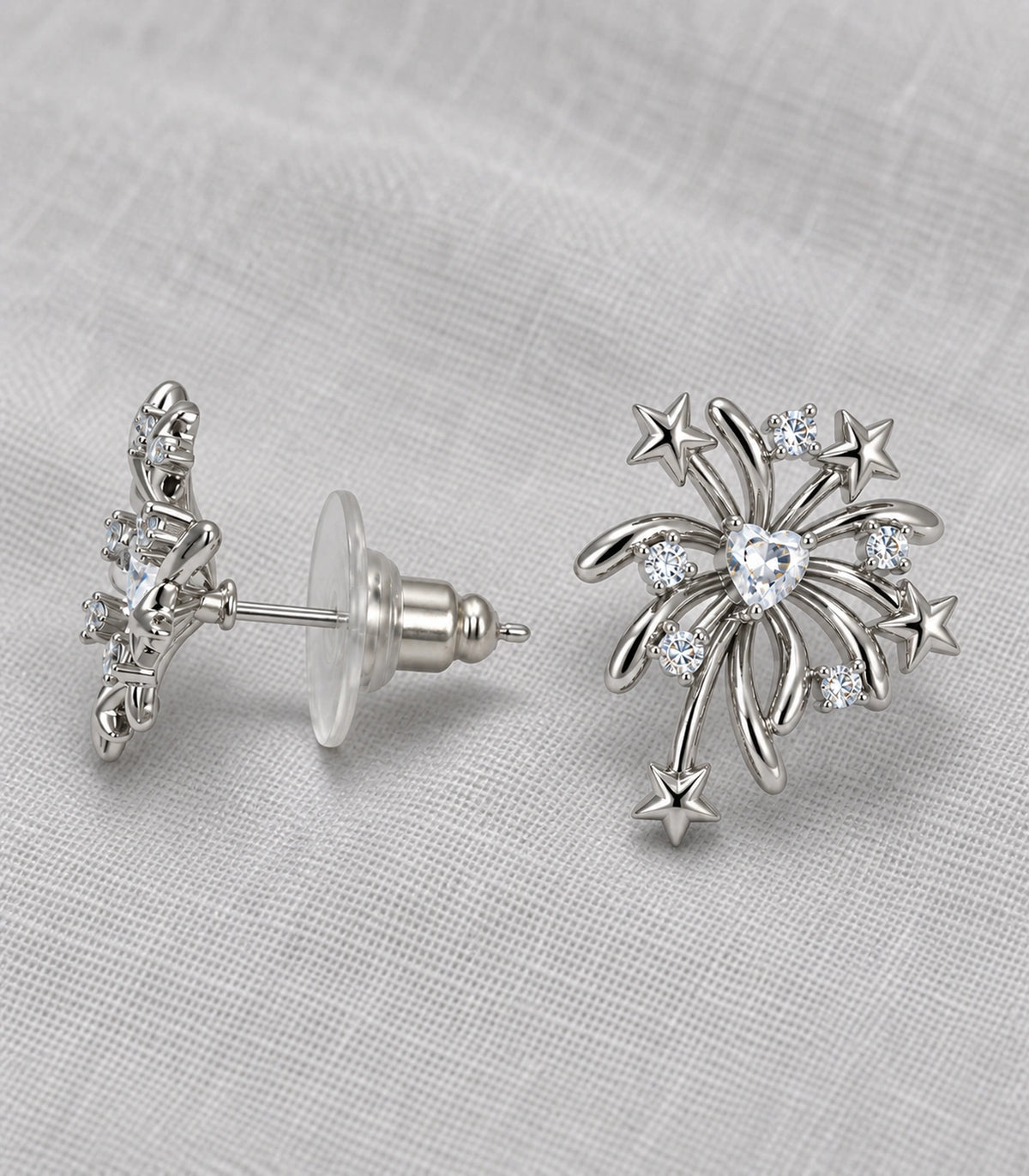 JIMIKI Heart Crystal Starburst Stud Earring Pair in Silver tone/Clear, editorial flat lay #color_silver tone/clear