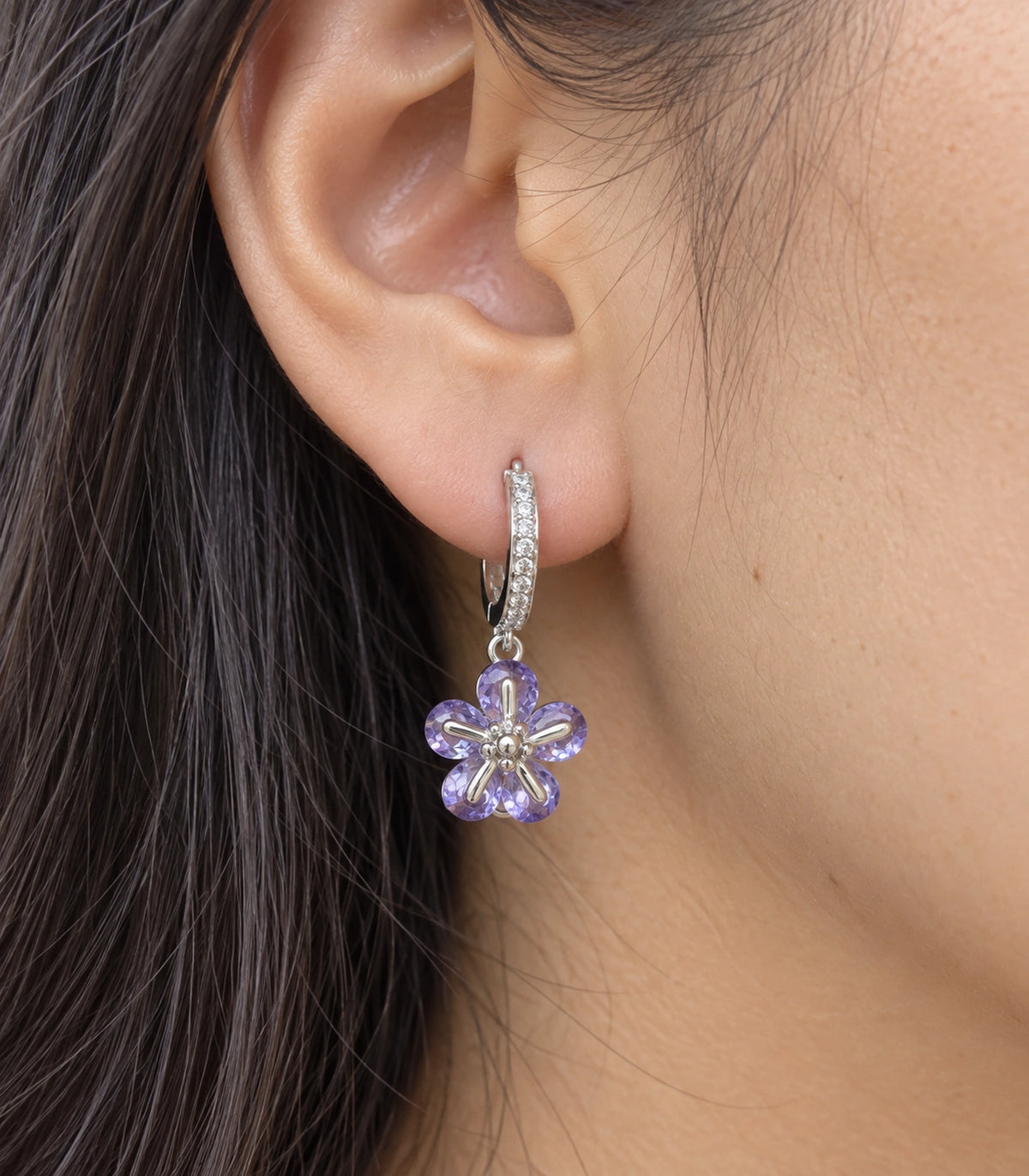 JIMIKI Silver-Tone Lavender Crystal Five-Petal Flower Huggie Earrings in Silver / Lavender, close-up detail