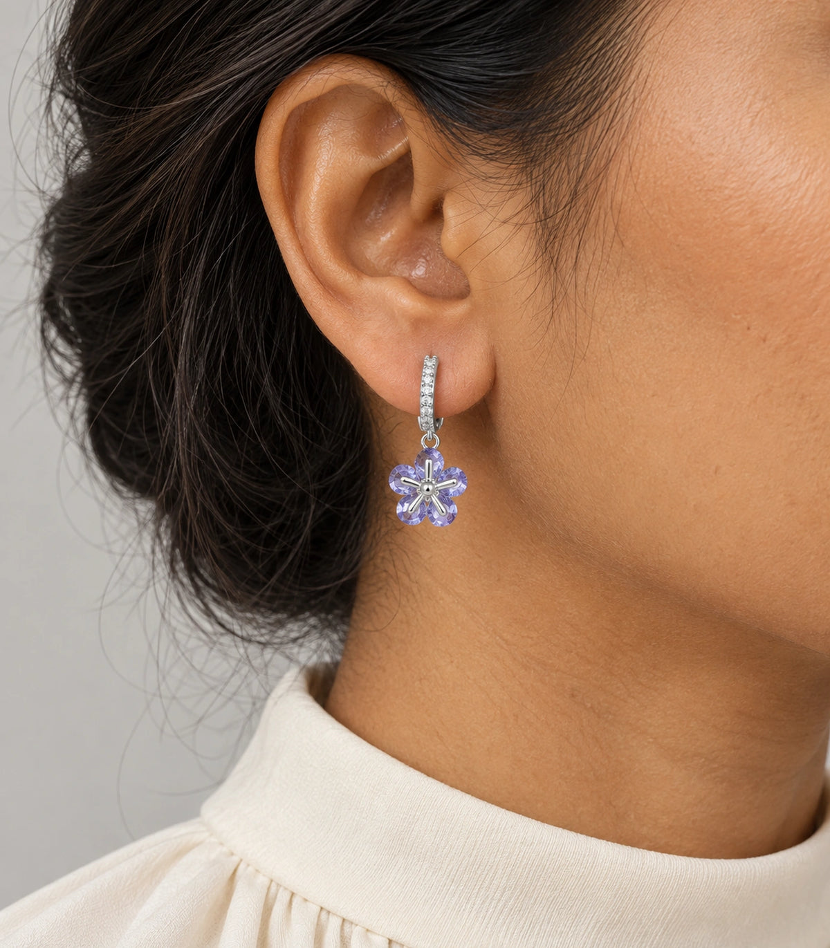 JIMIKI Silver-Tone Lavender Crystal Five-Petal Flower Huggie Earrings in Silver / Lavender, model wearing view