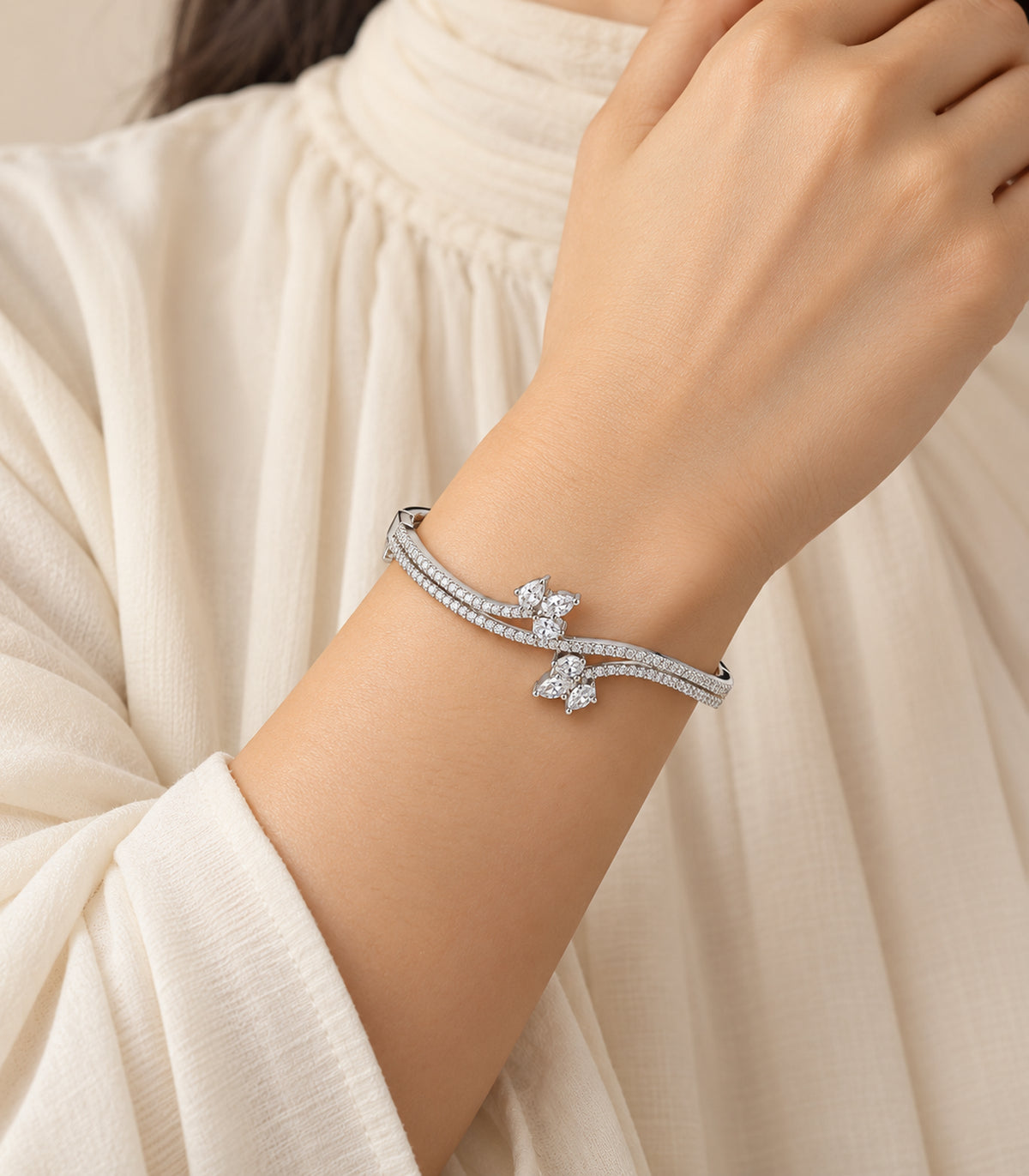 Silver-tone marquise cluster crossover bangle, editorial model view