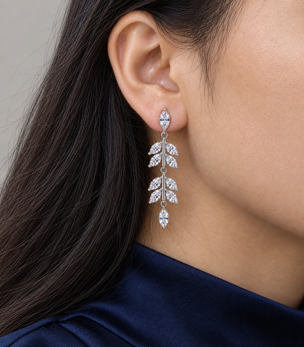 JIMIKI Marquise Crystal Leaf Drop Earring Pair in Silver tone, close-up detail #color_silver tone