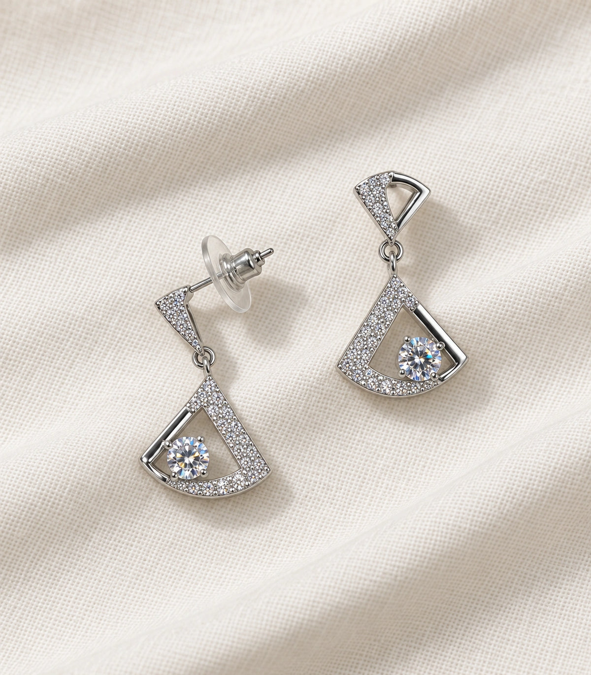 JIMIKI Open Fan Crystal Drop Earring Pair in Silver Tone, editorial flat lay #color_silver tone