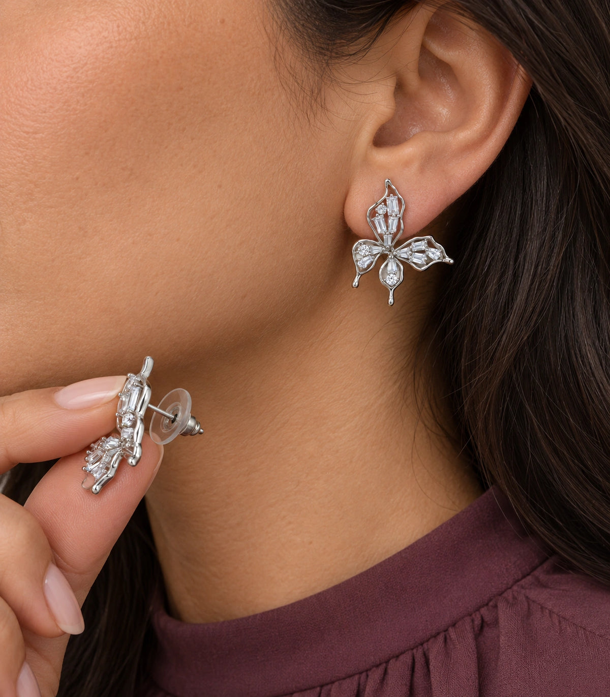 JIMIKI Openwork Baguette Crystal Butterfly Stud Earring Pair in Silver-tone, model wearing view #color_silver-tone