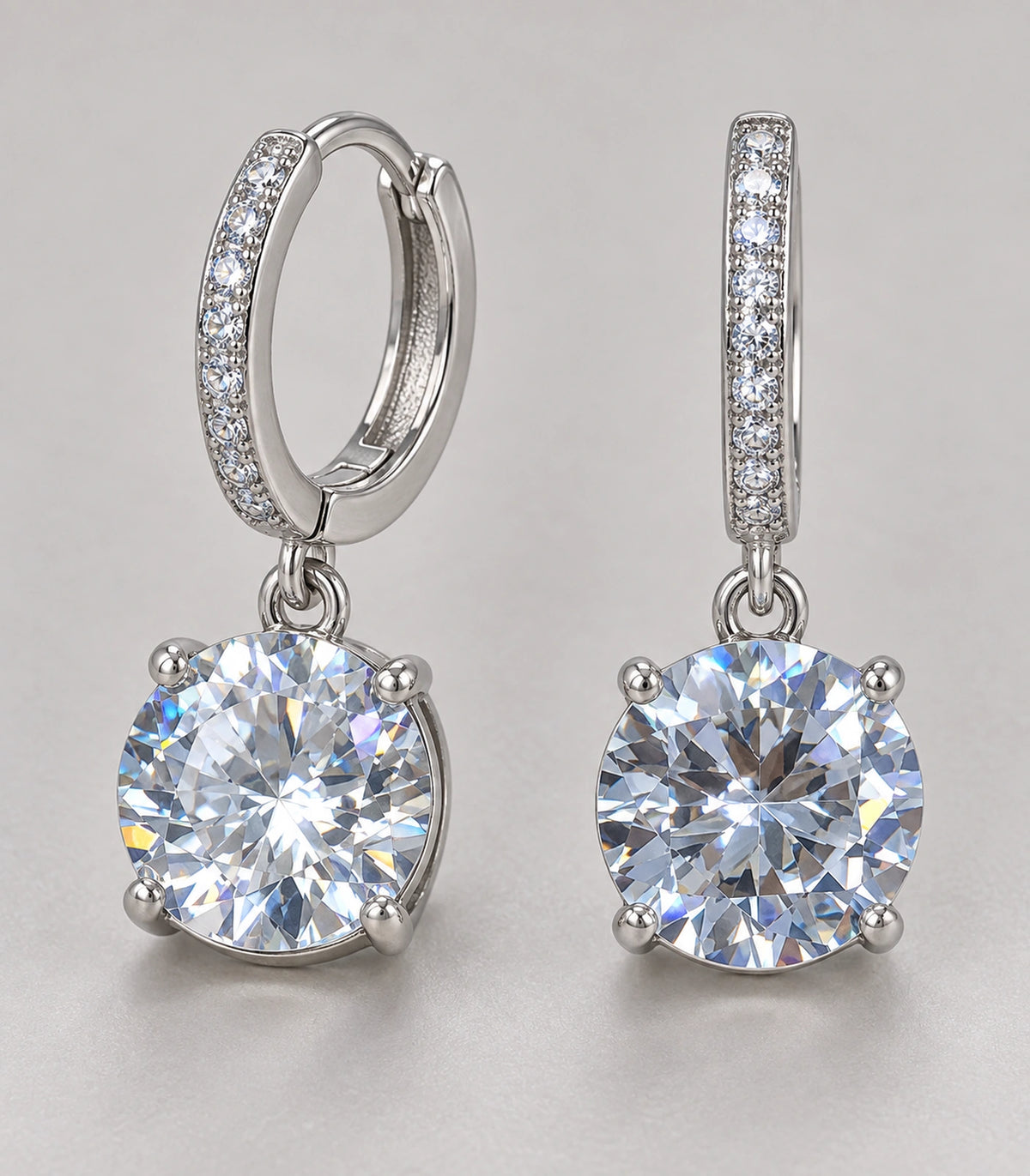 JIMIKI Silver-Tone Oversized Round Solitaire Drop Huggie Earrings in Silver / Clear, close-up detail