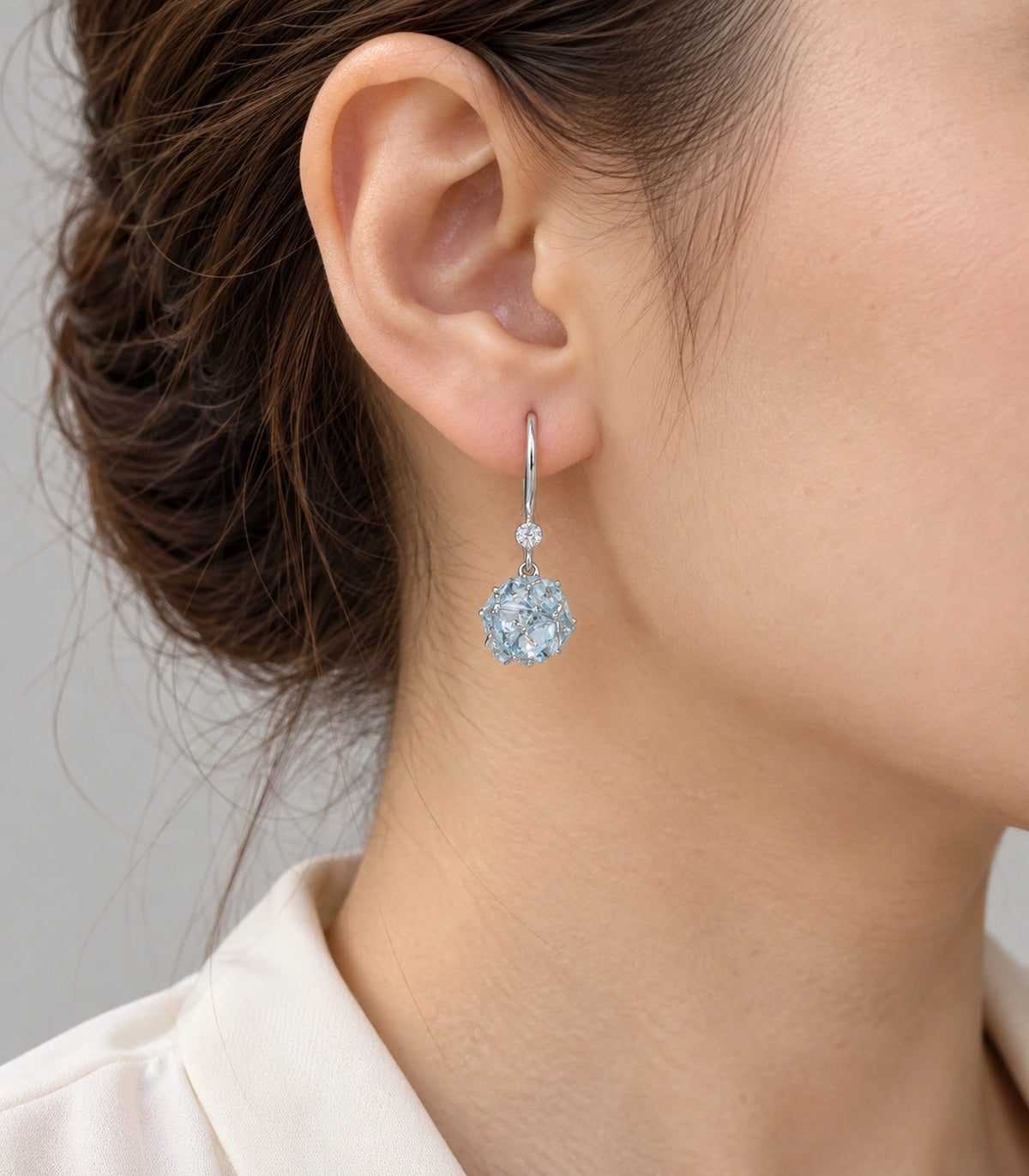 JIMIKI Silver Tone Pale Blue Crystal Ball Drop Earring Pair in Silver-tone, model wearing view