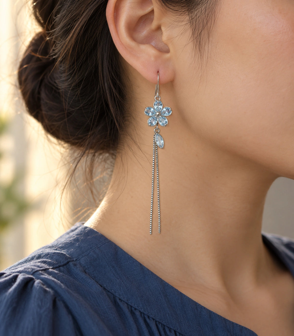 JIMIKI Silver Tone Pale Blue Flower Leaf Chain Earring Pair in Silver-tone, editorial model view