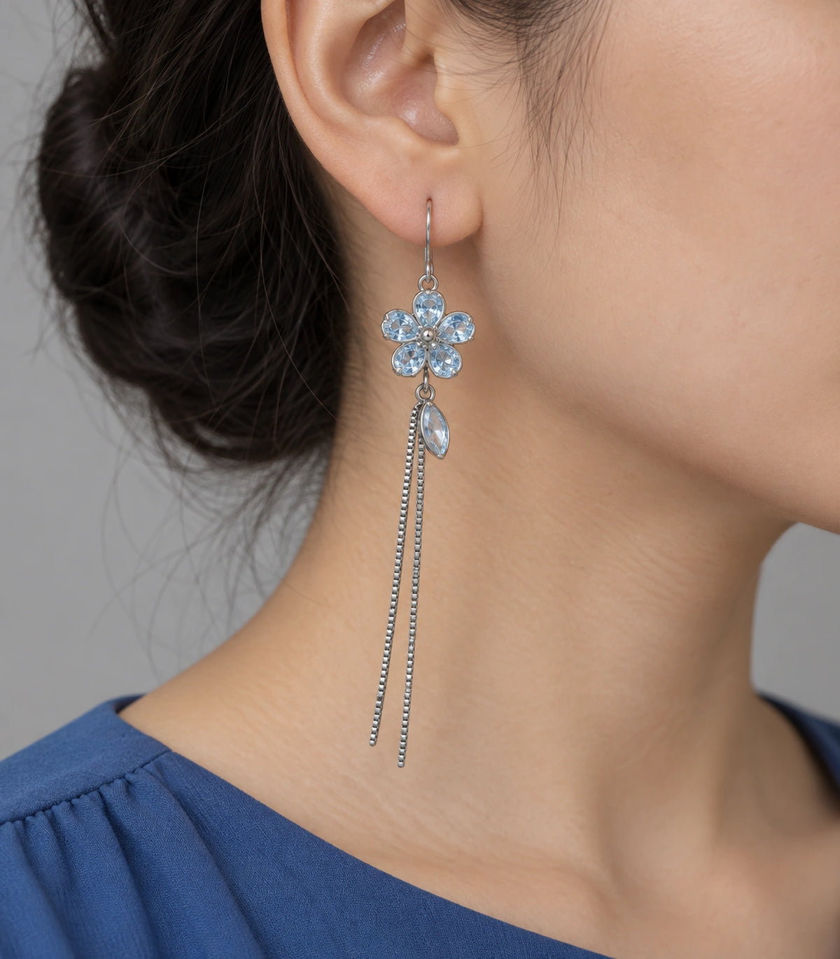 JIMIKI Silver Tone Pale Blue Flower Leaf Chain Earring Pair in Silver-tone, model wearing view