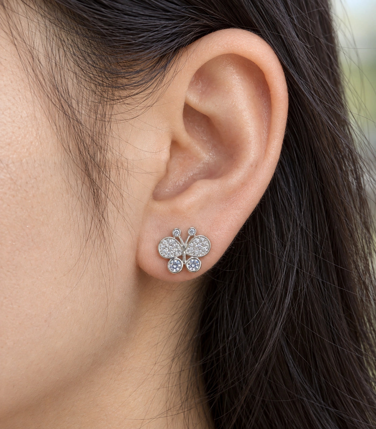 JIMIKI Silver-Tone Pave Crystal Butterfly Stud Earrings in Silver Tone, close-up detail