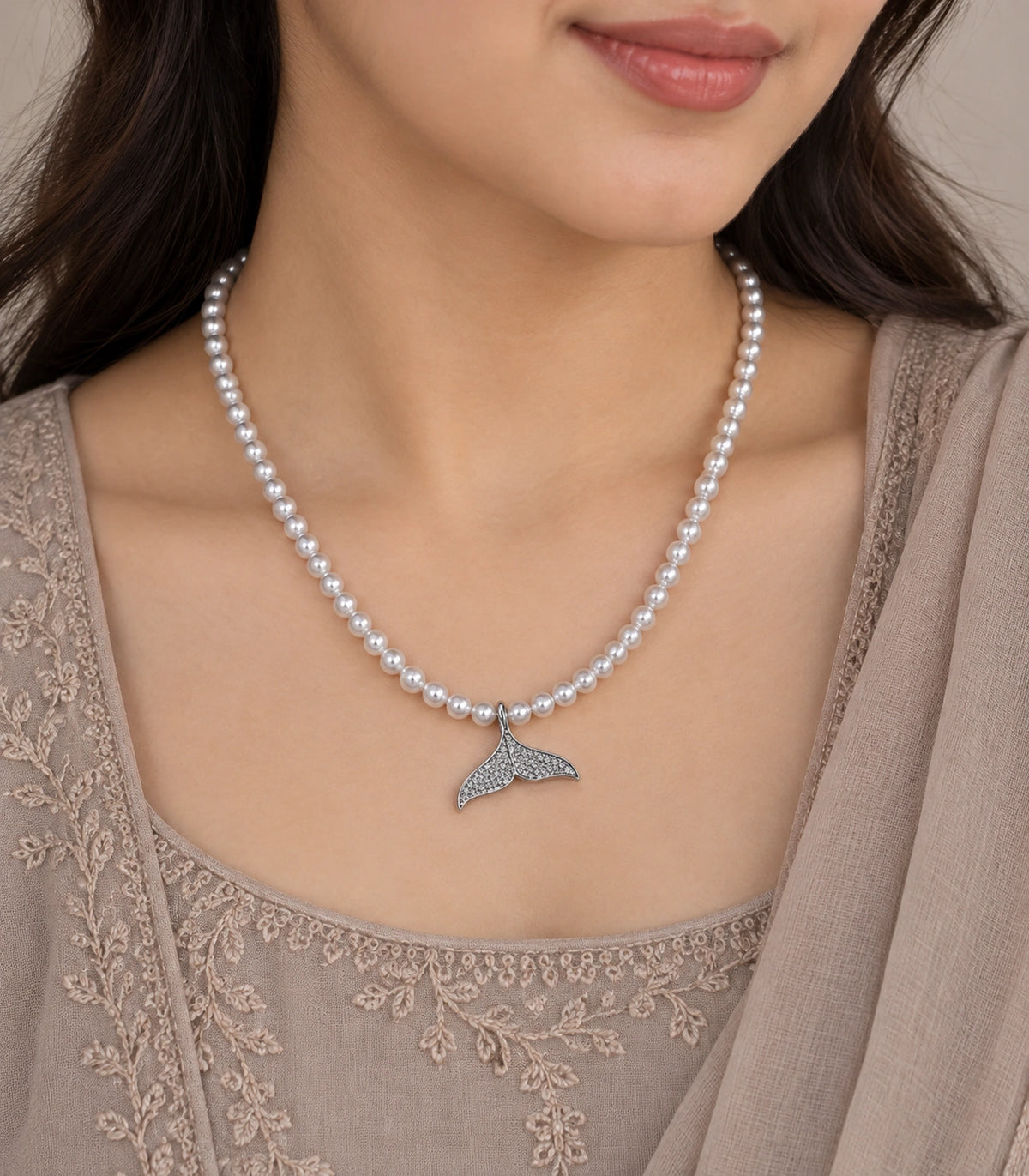 JIMIKI Pavé Whale Tail Pearl Necklace in Silver-tone, close-up of the pendant and pearl-style strand #color_silver-tone