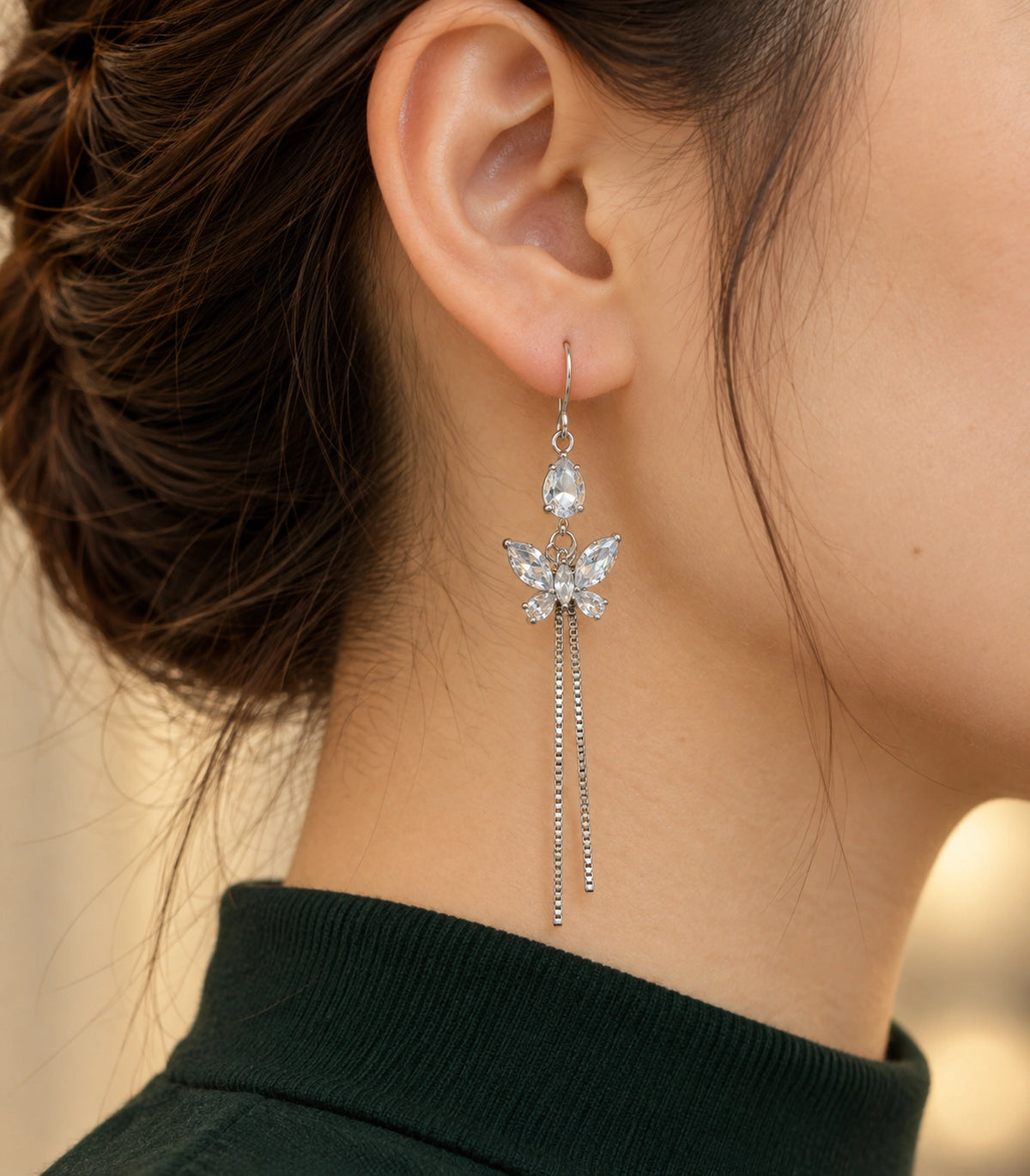 JIMIKI Silver Tone Pear Butterfly Twin Chain Earring Pair in Silver-tone, editorial model view